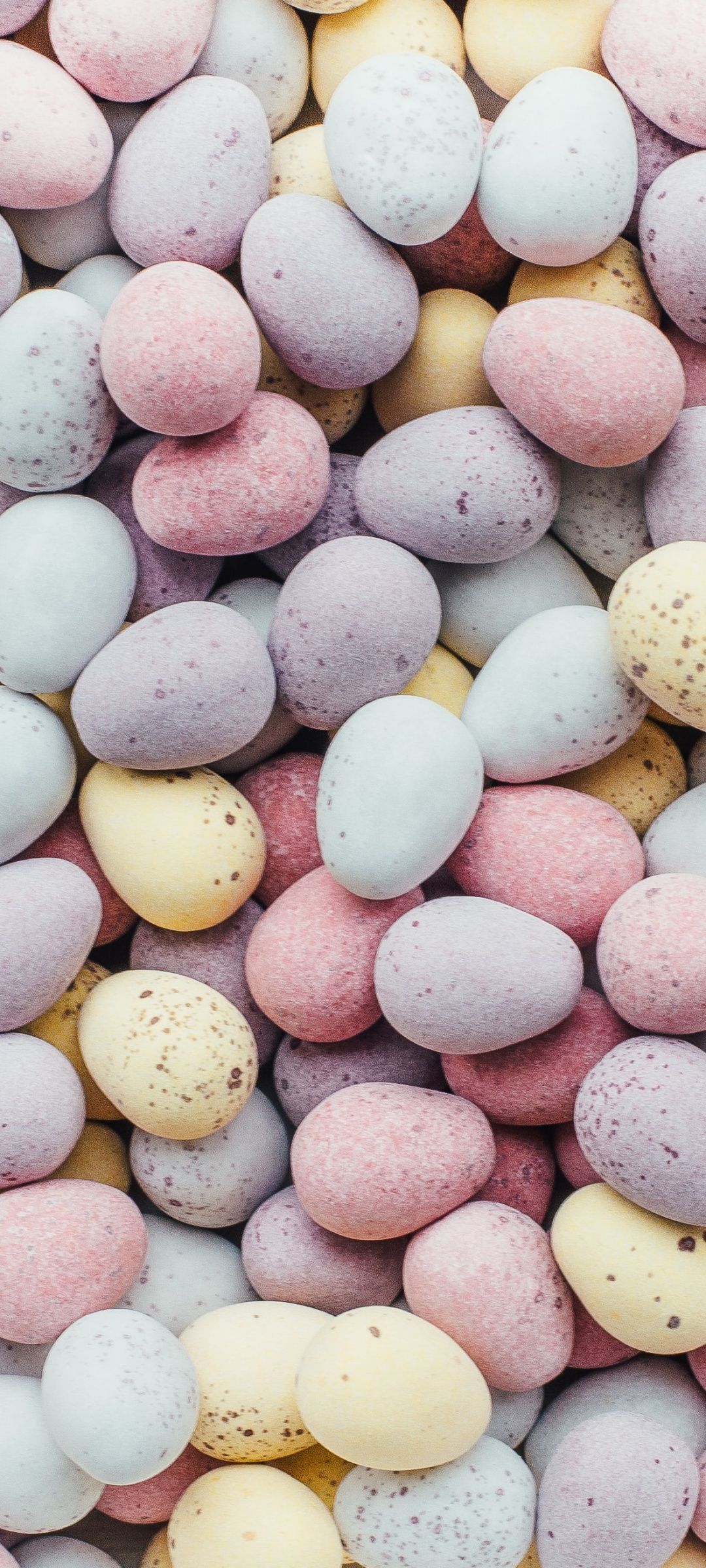 IPhone wallpaper of a pile of pastel Easter eggs. - Easter, egg
