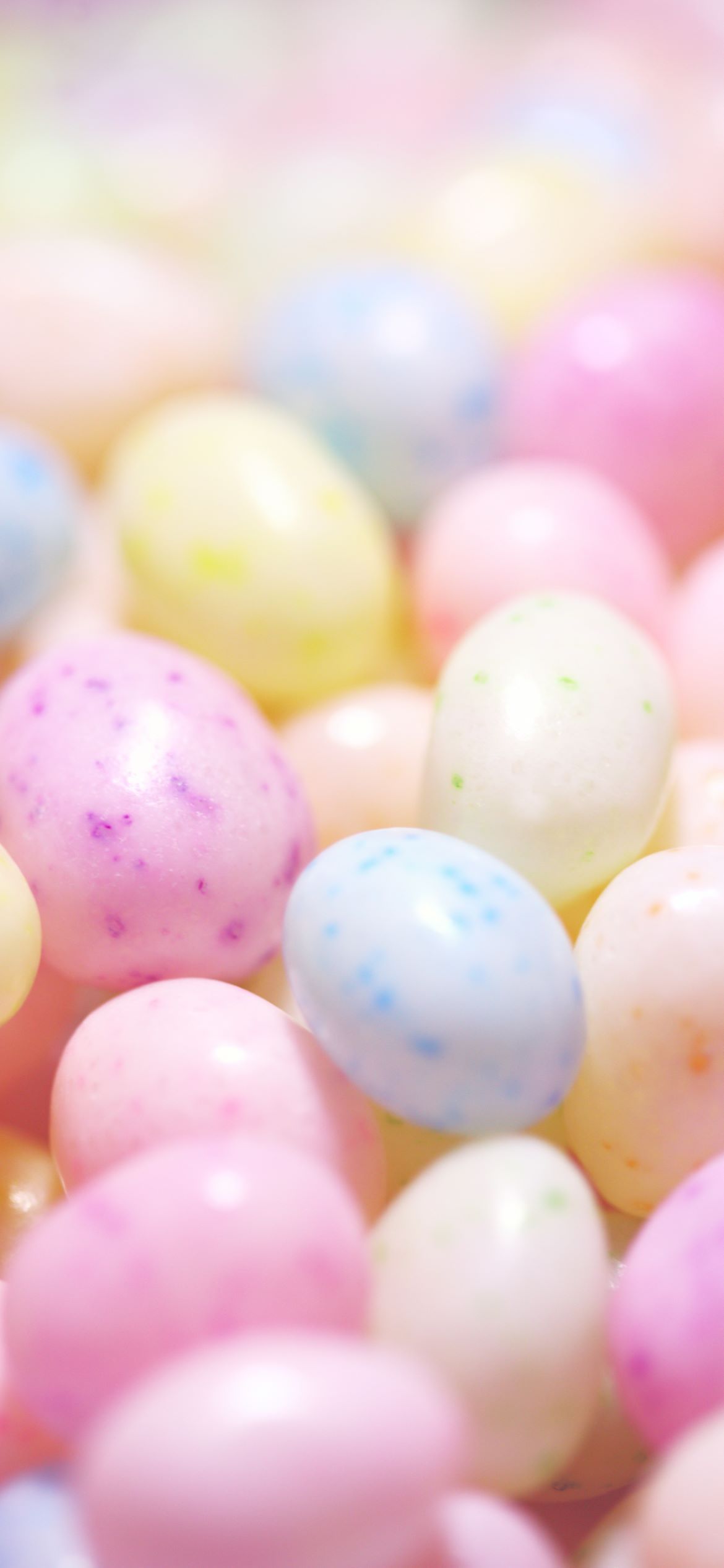 A close up of jelly beans in pastel colors. - Easter, egg