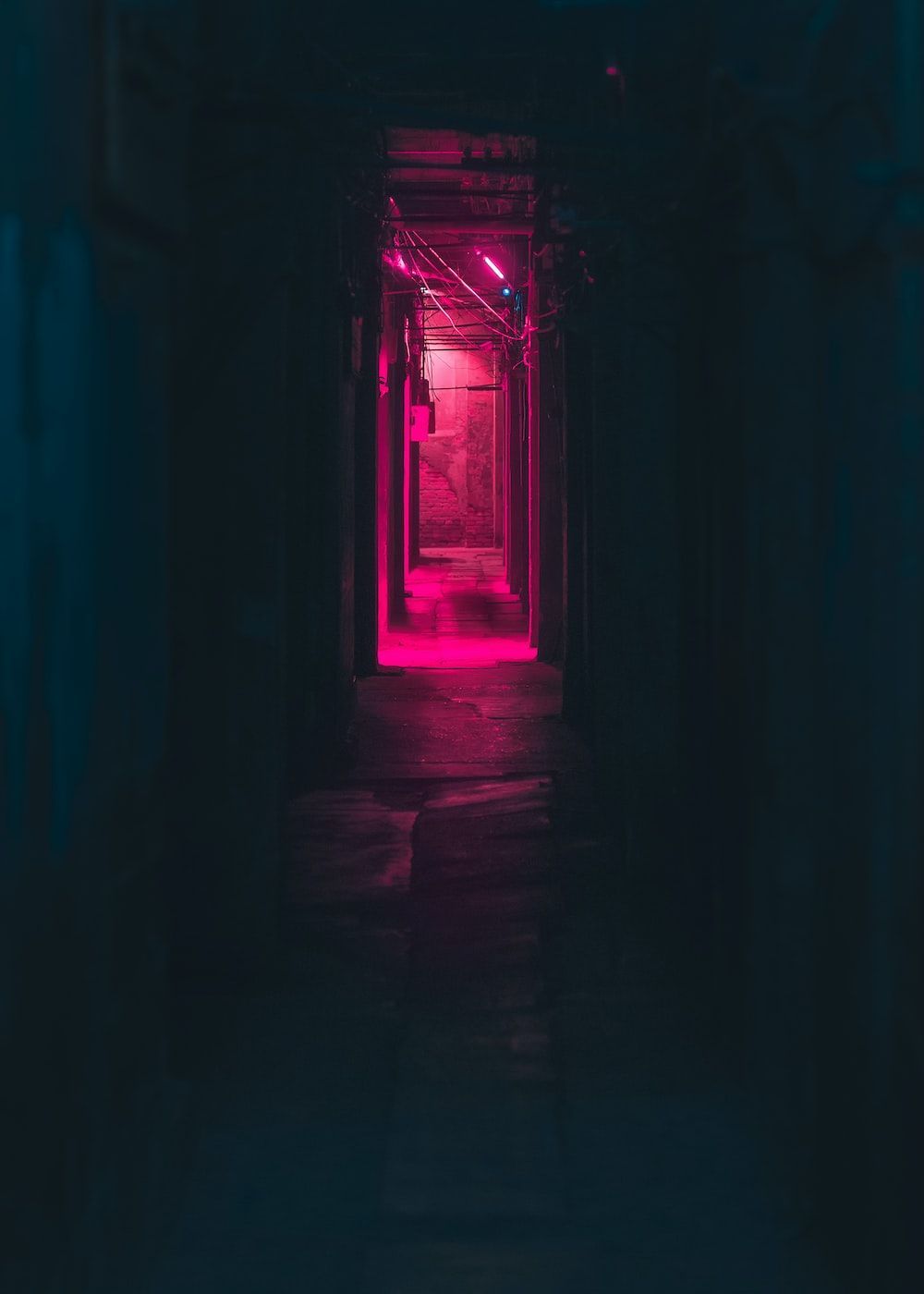 A dark hallway with pink lights. - Cyberpunk