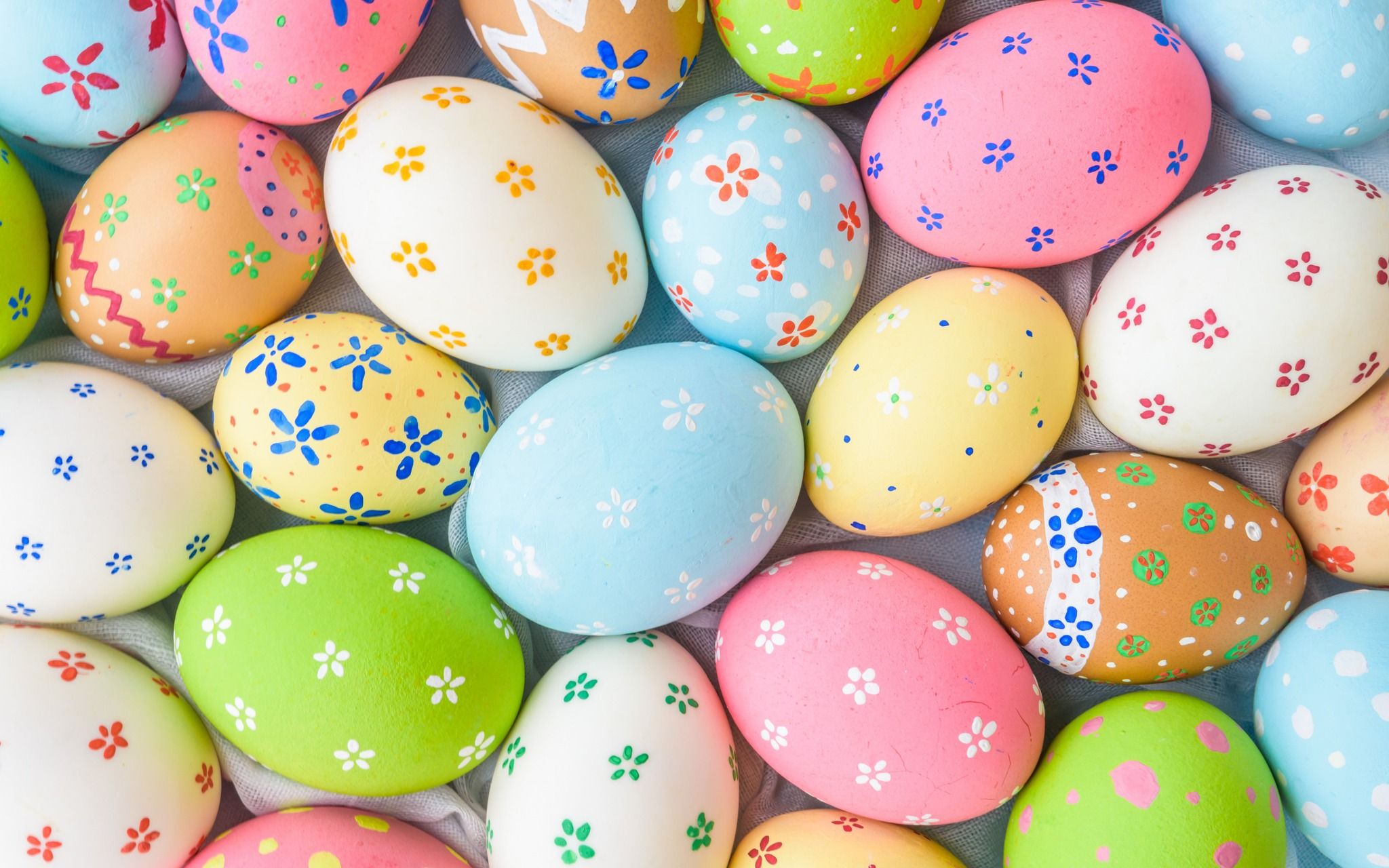 A collection of colorful Easter eggs with floral designs. - Easter, egg