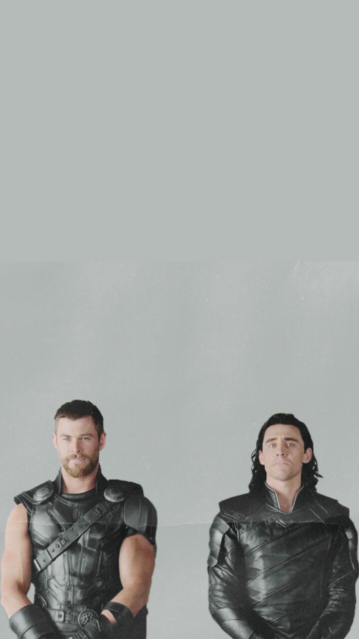 Two men in leather jackets sitting on a couch - Loki, Thor