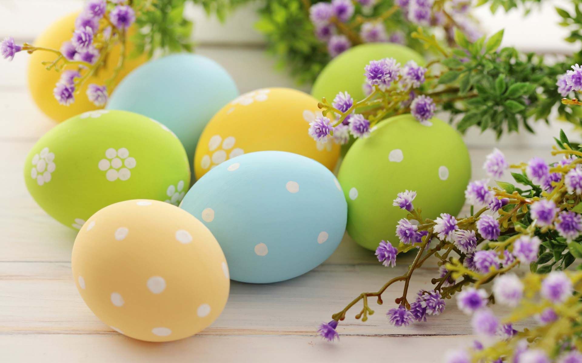 Easter eggs with flowers on a wooden table - Easter