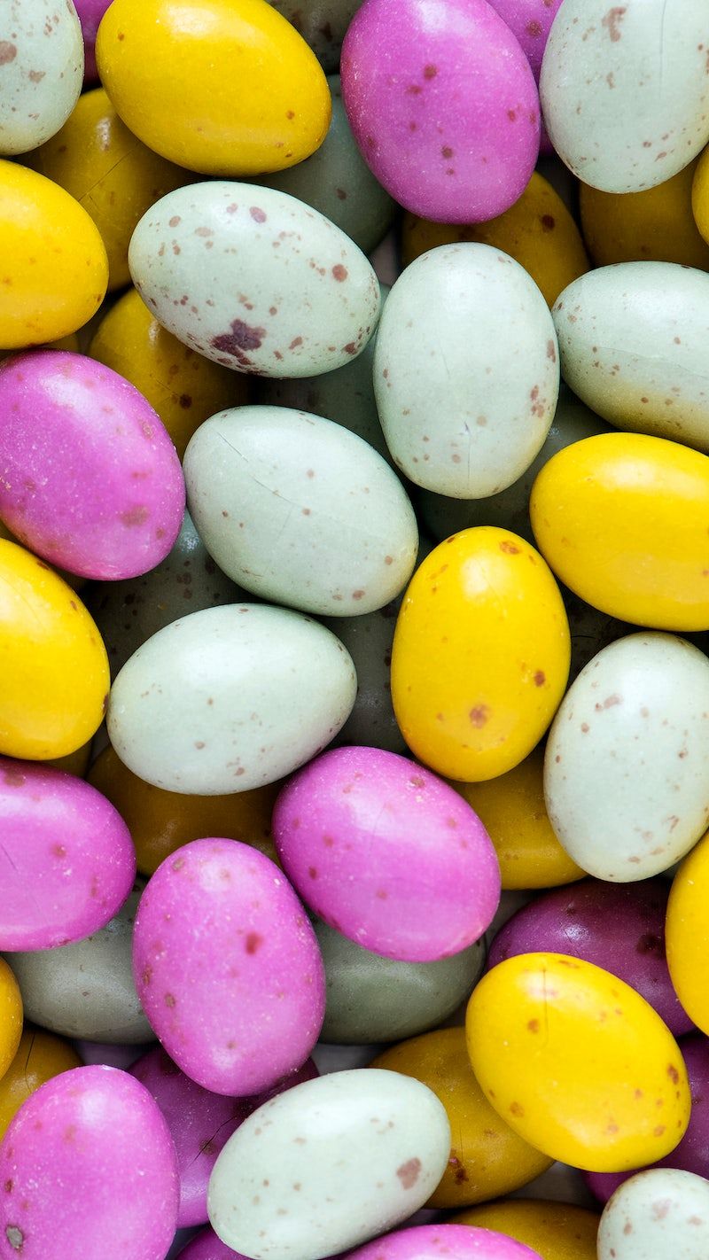 A pile of colorful chocolate eggs. - Easter