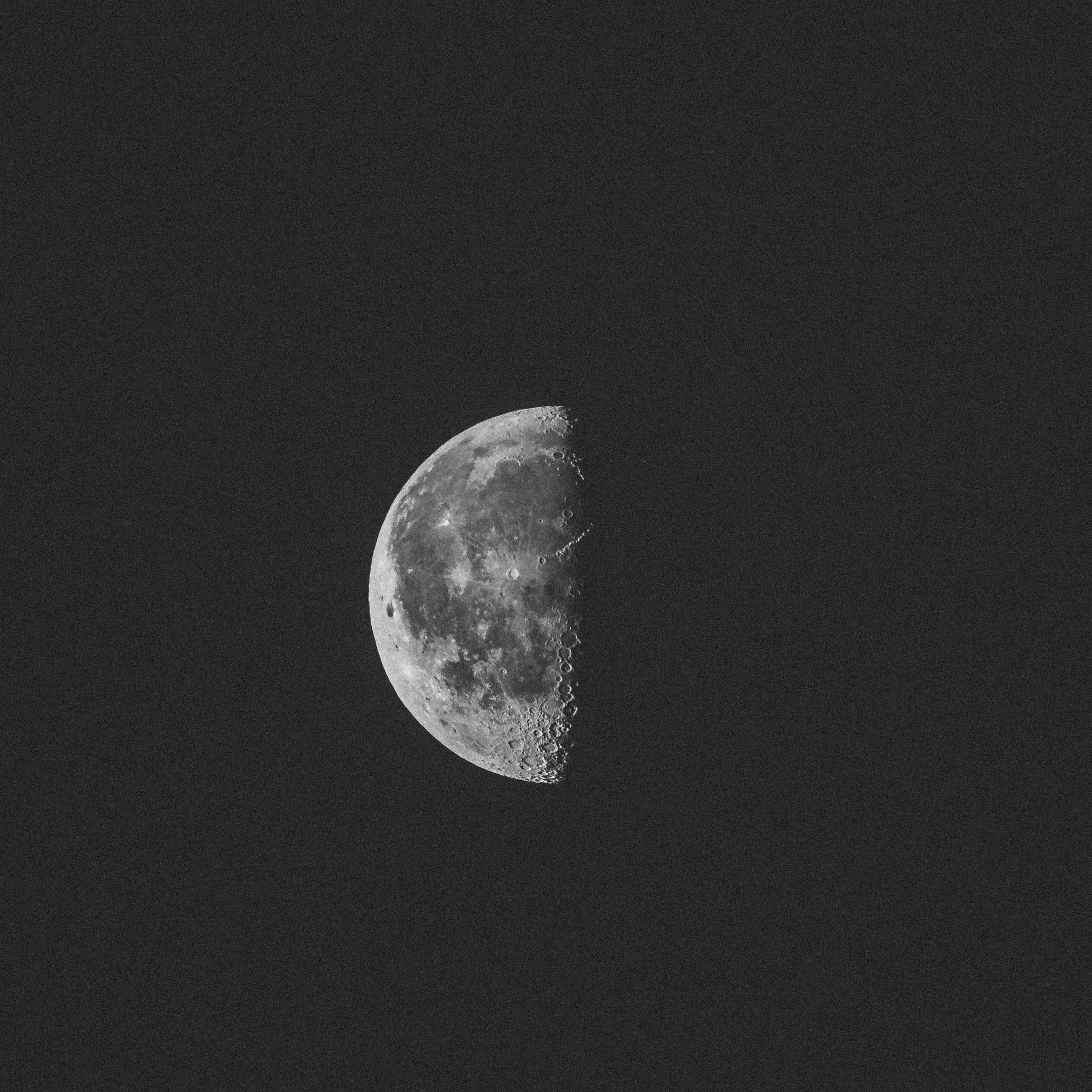 A black and white photo of the moon - Moon