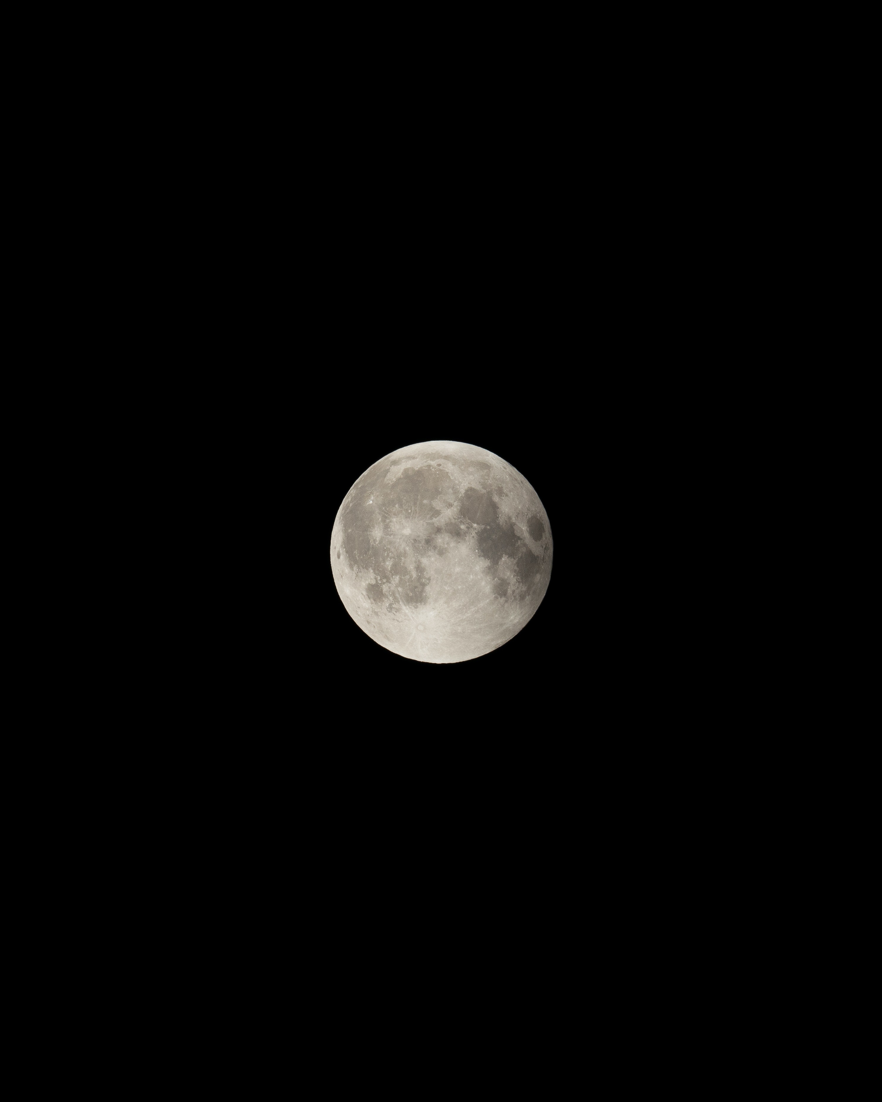 A full moon in a black sky. - Moon