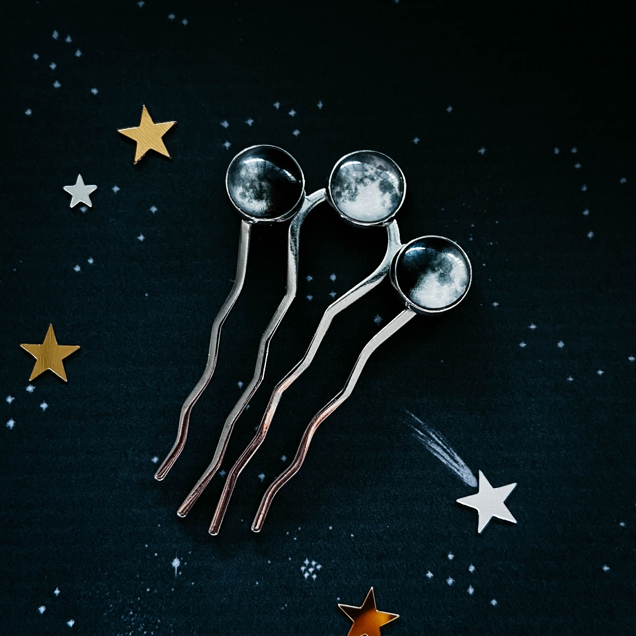 A set of three hair combs with stars - Moon phases