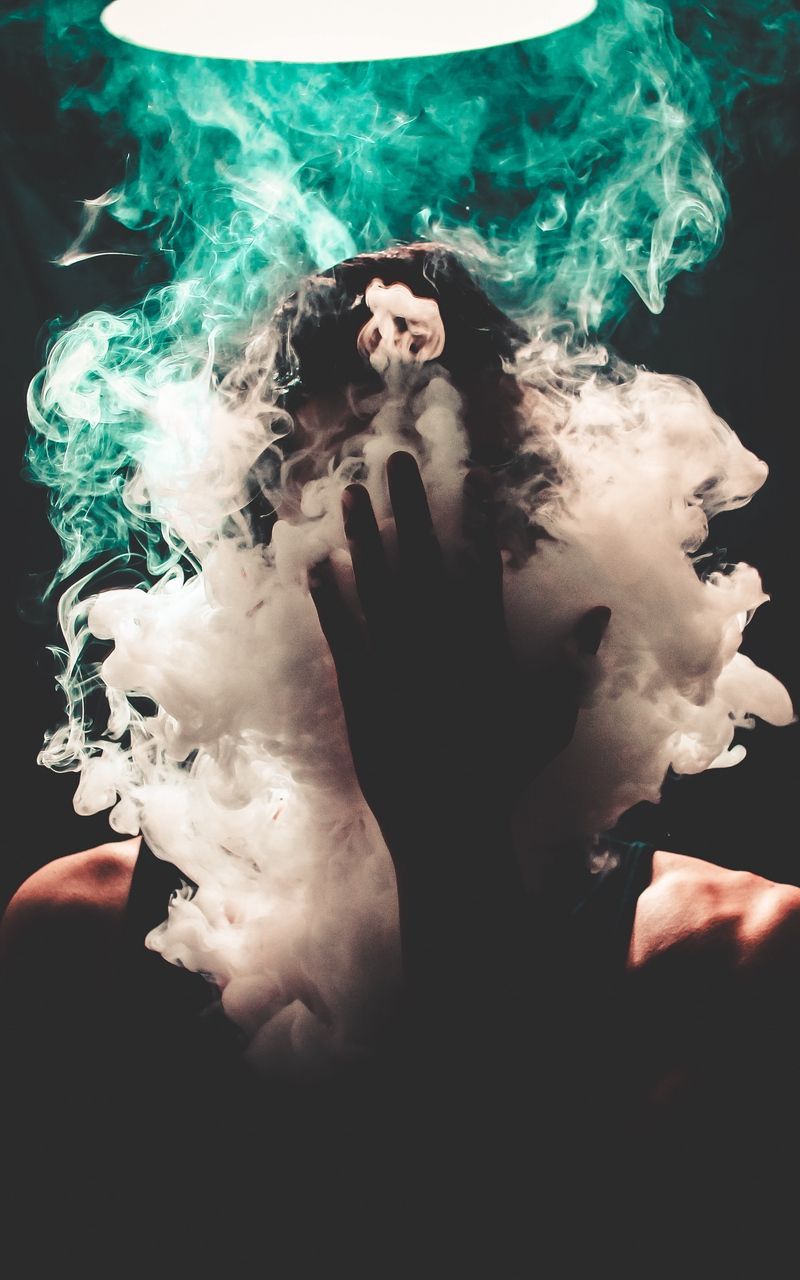 A person with smoke coming out of their mouth - Smoke