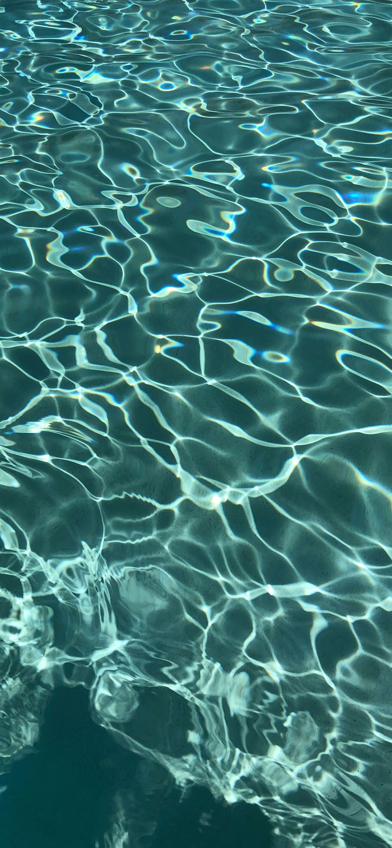 A close up of the water in an outdoor pool - Water