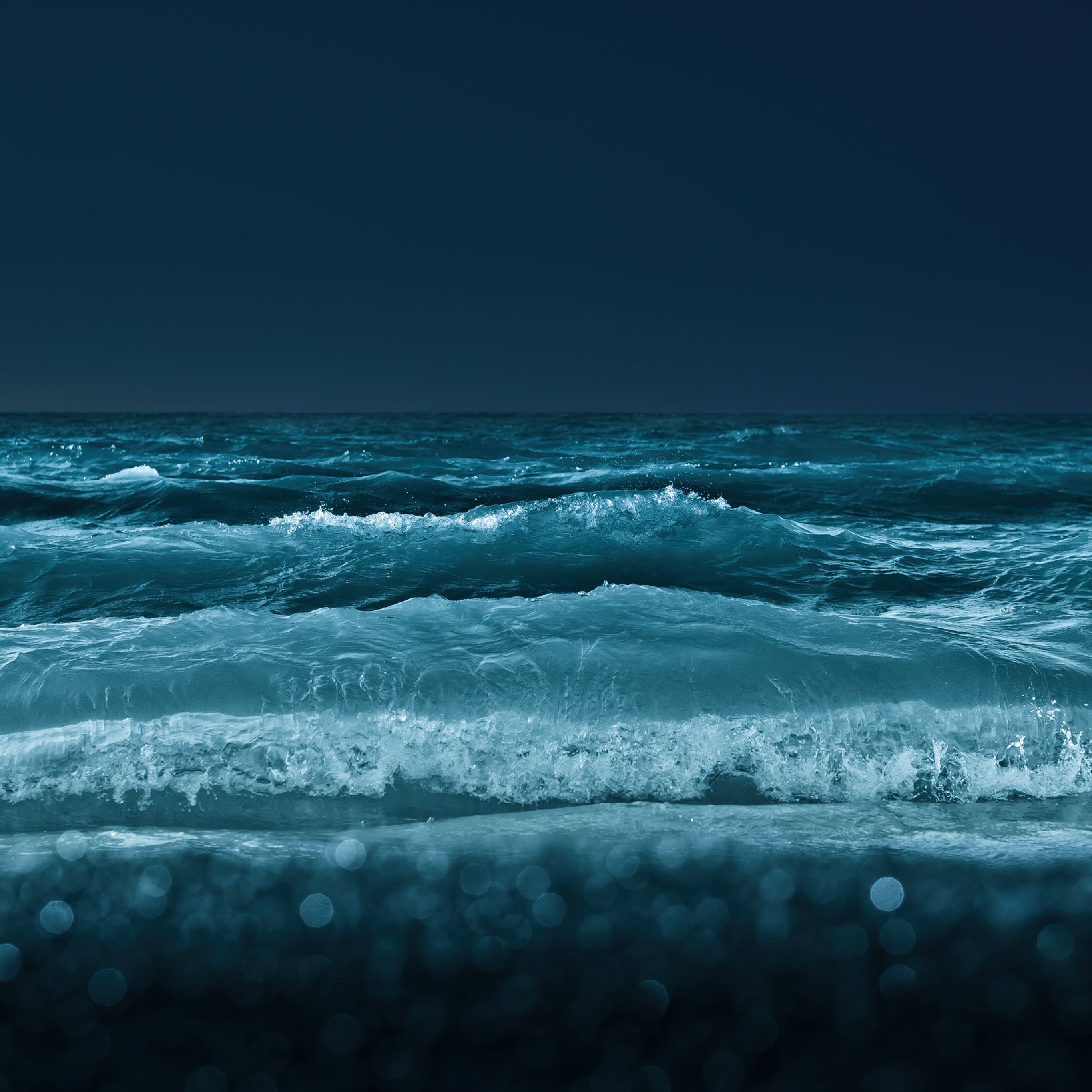 A deep blue ocean at night with a starry sky - Water, lake