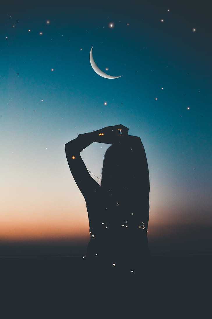 A woman's silhouette is shown against a night sky with stars and the moon. - Stars