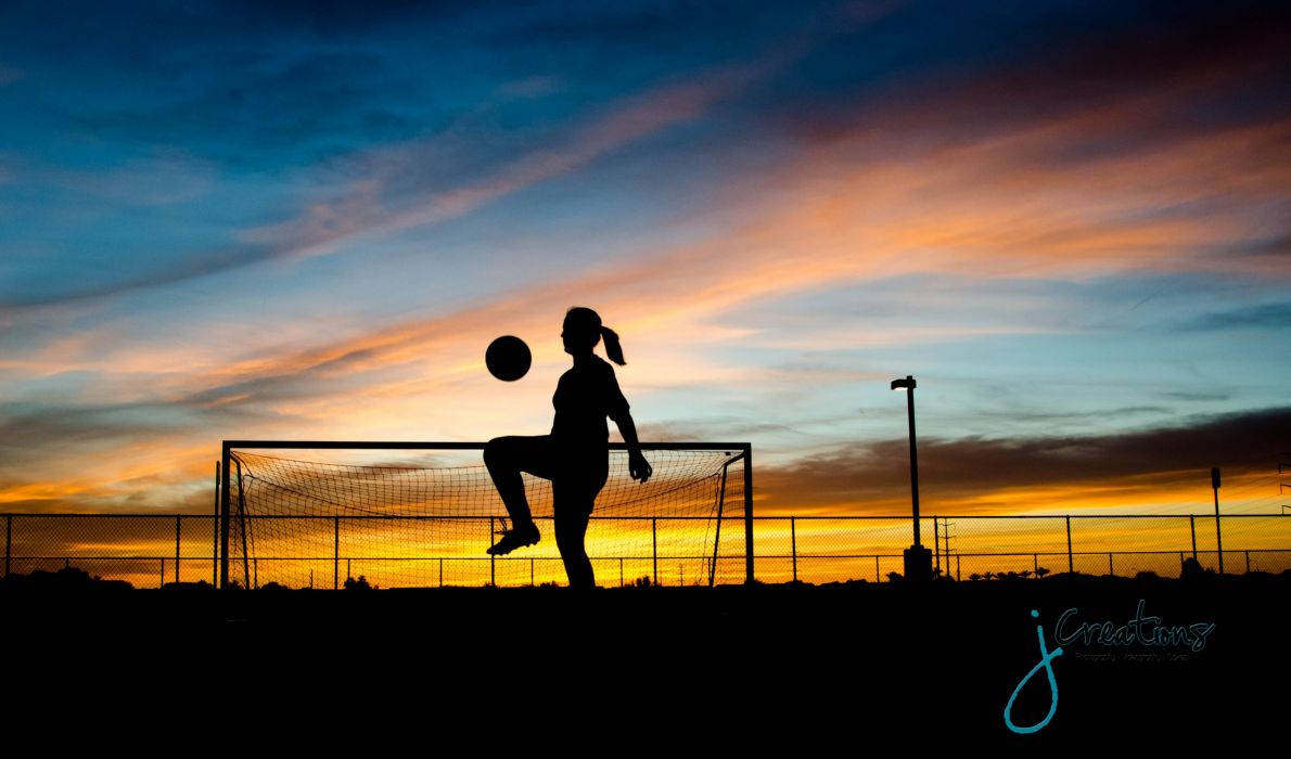 Silhouette of a girl playing soccer at sunset with a brief description of this image, at least 20 words but no longer than 50 words - Soccer