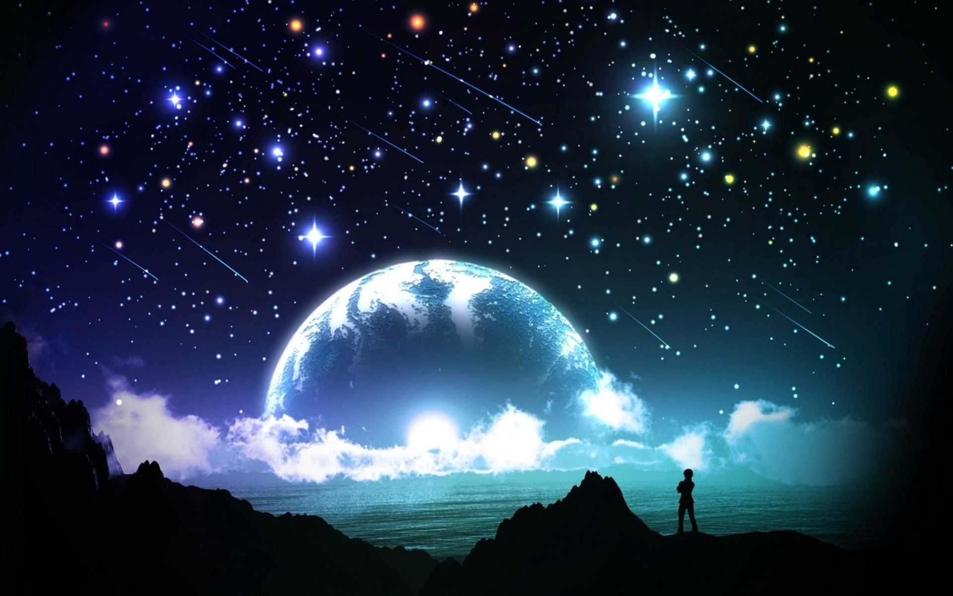 Person standing on a hill looking at a starry sky - Stars, moon