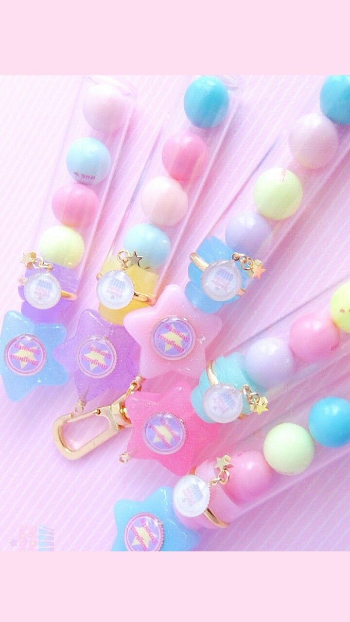Some cute little keychains with a pink background - Candy