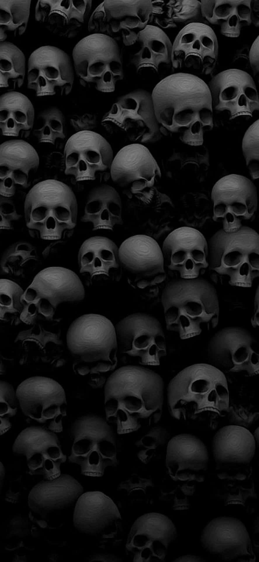 Black and white wallpaper of a wall of skulls - Horror, creepy