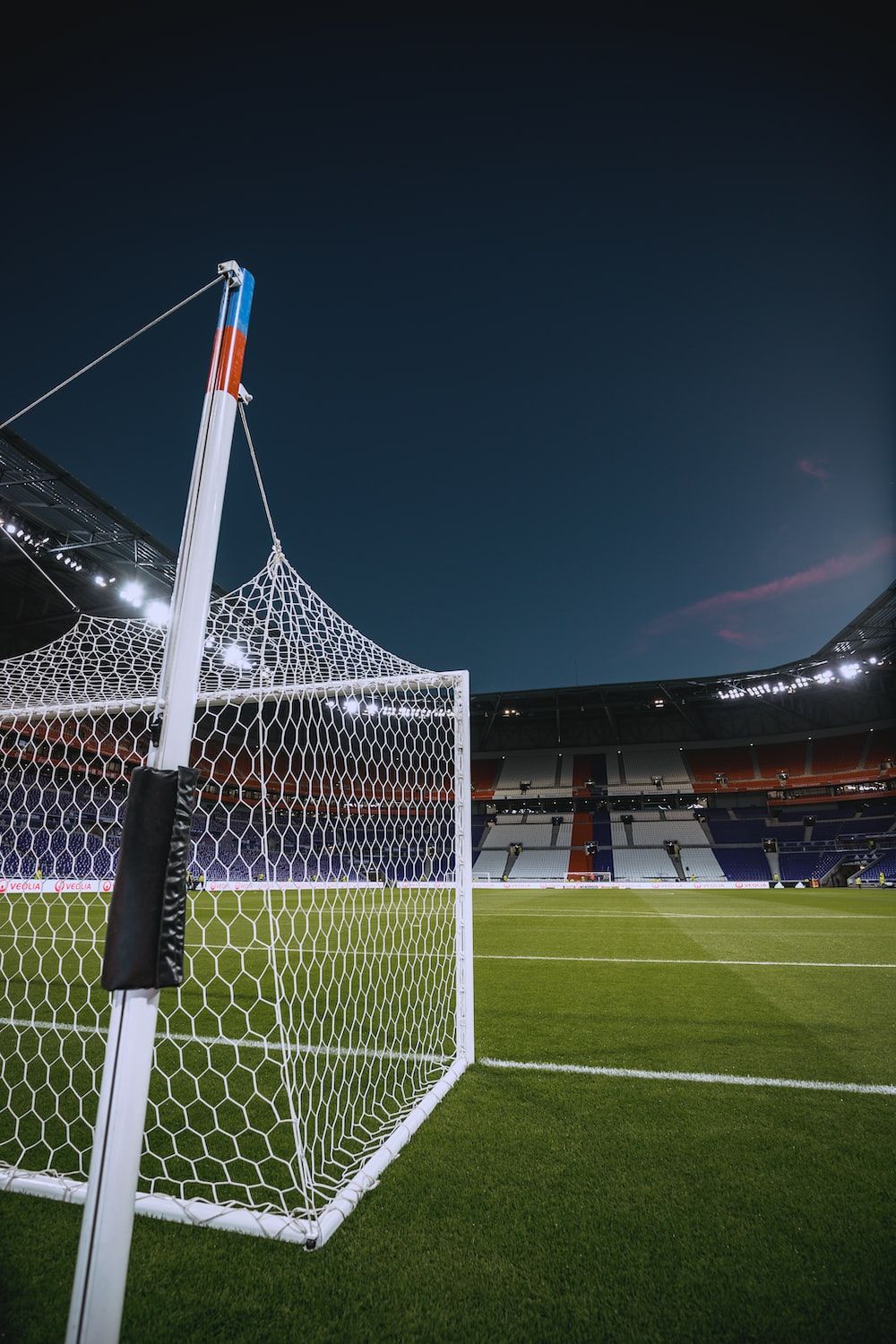 A soccer goal in the middle of an empty field - Soccer