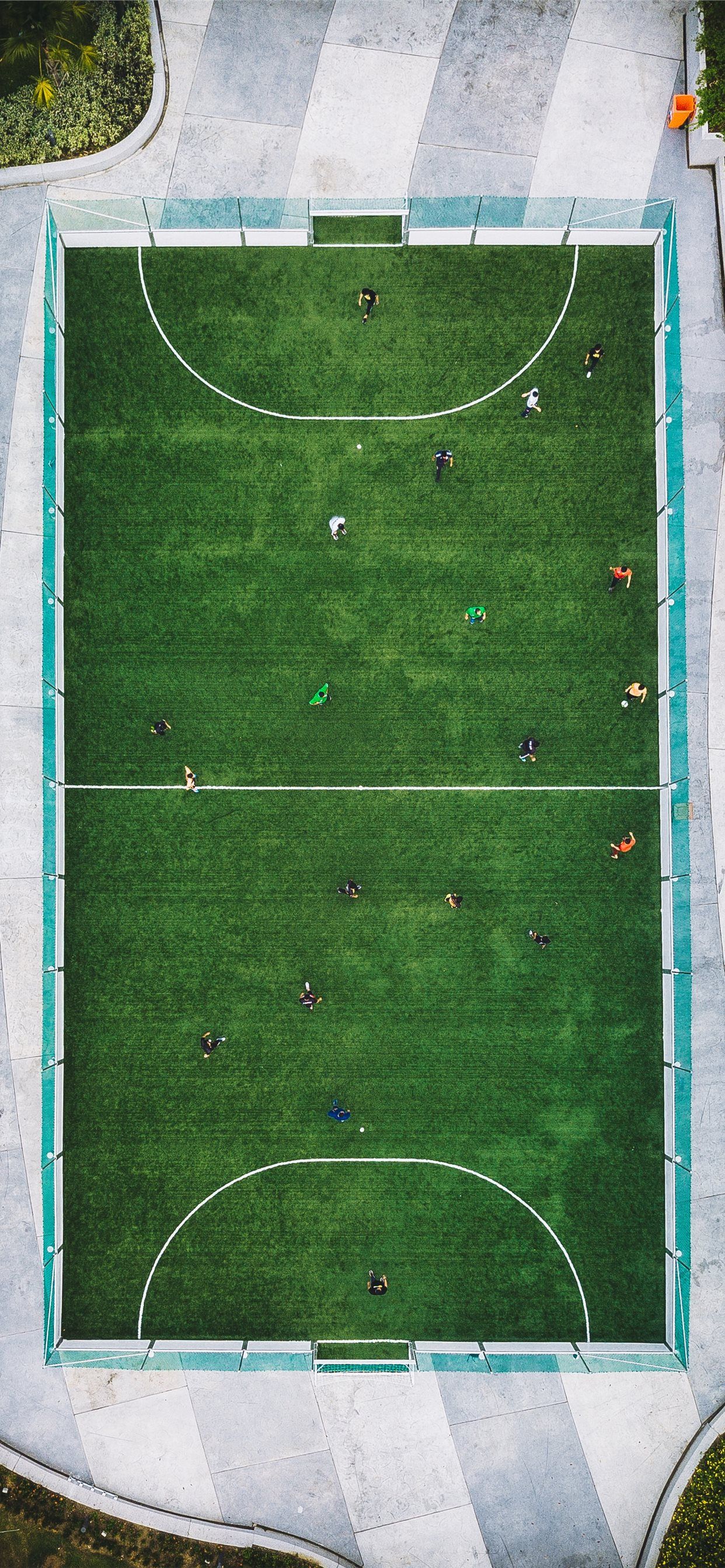 A view of people playing soccer on the grass - Soccer