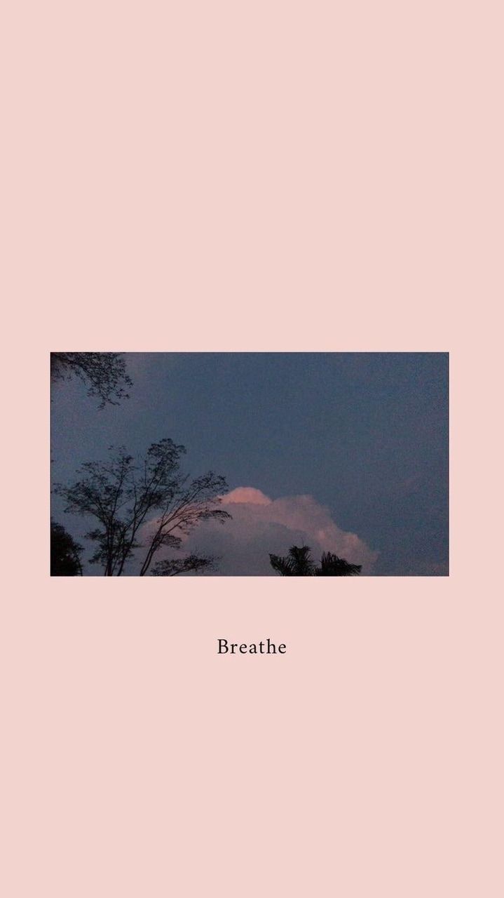 A photo of a pink sky with the word breathe written underneath - Landscape