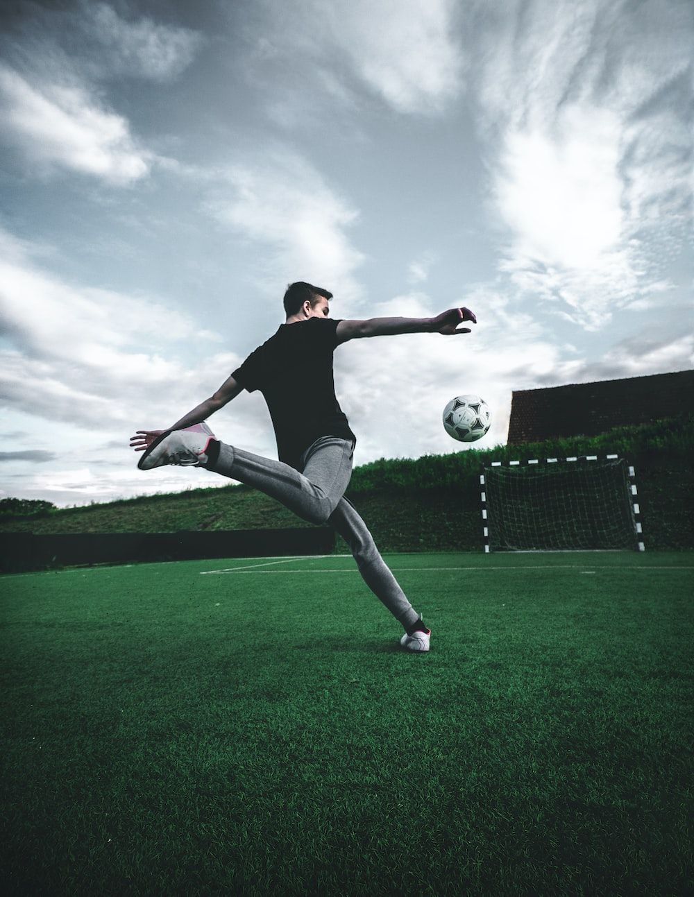 A man is kicking the soccer ball - Soccer