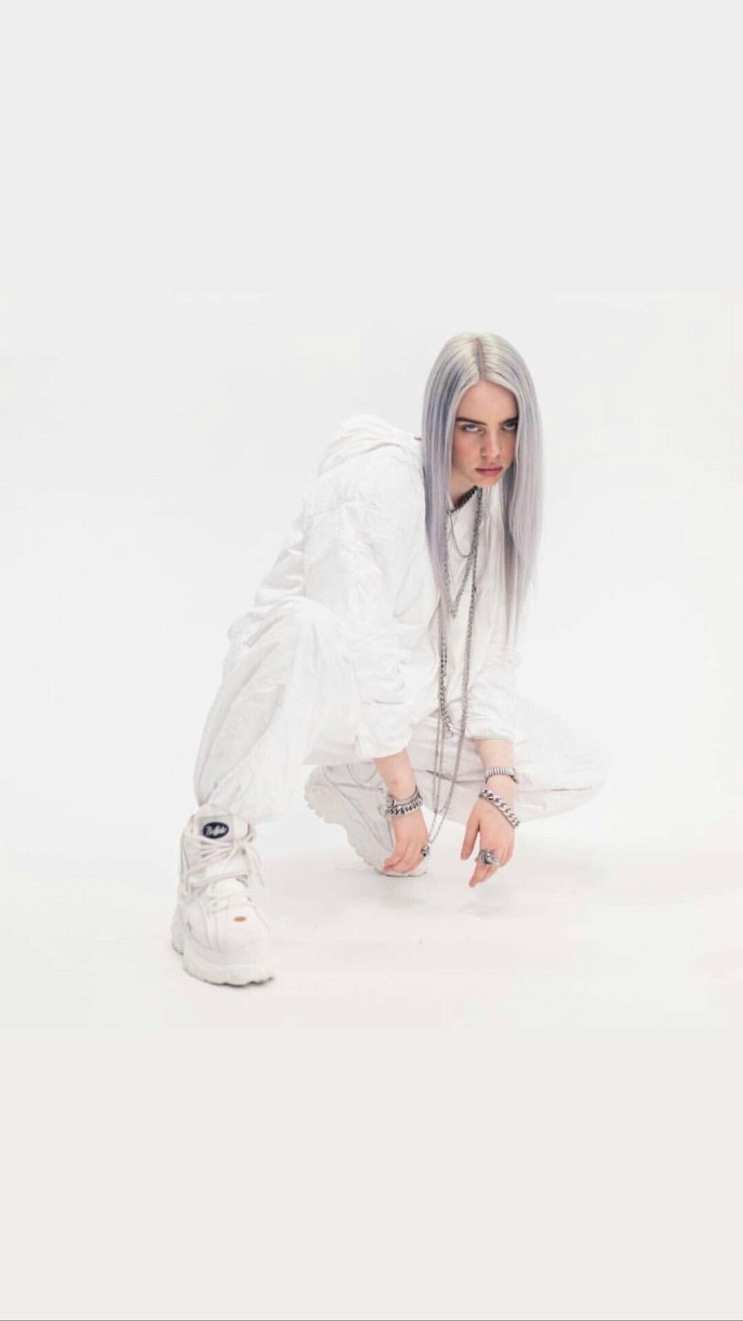A person with white hair and sneakers - Billie Eilish
