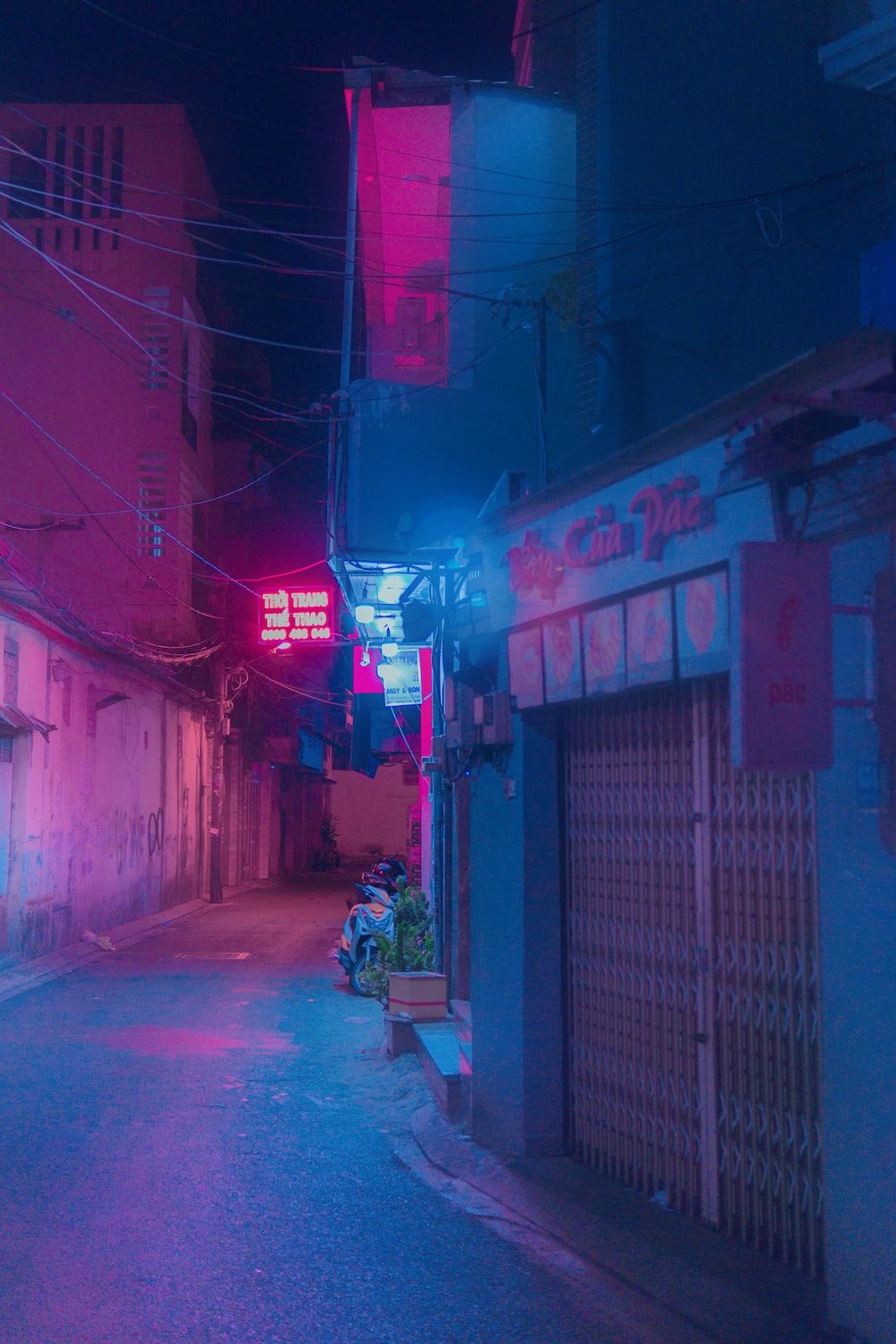 A street with buildings and neon lights - Neon, punk