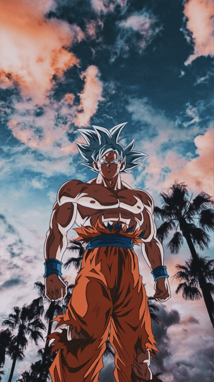 A man standing in front of palm trees - Goku