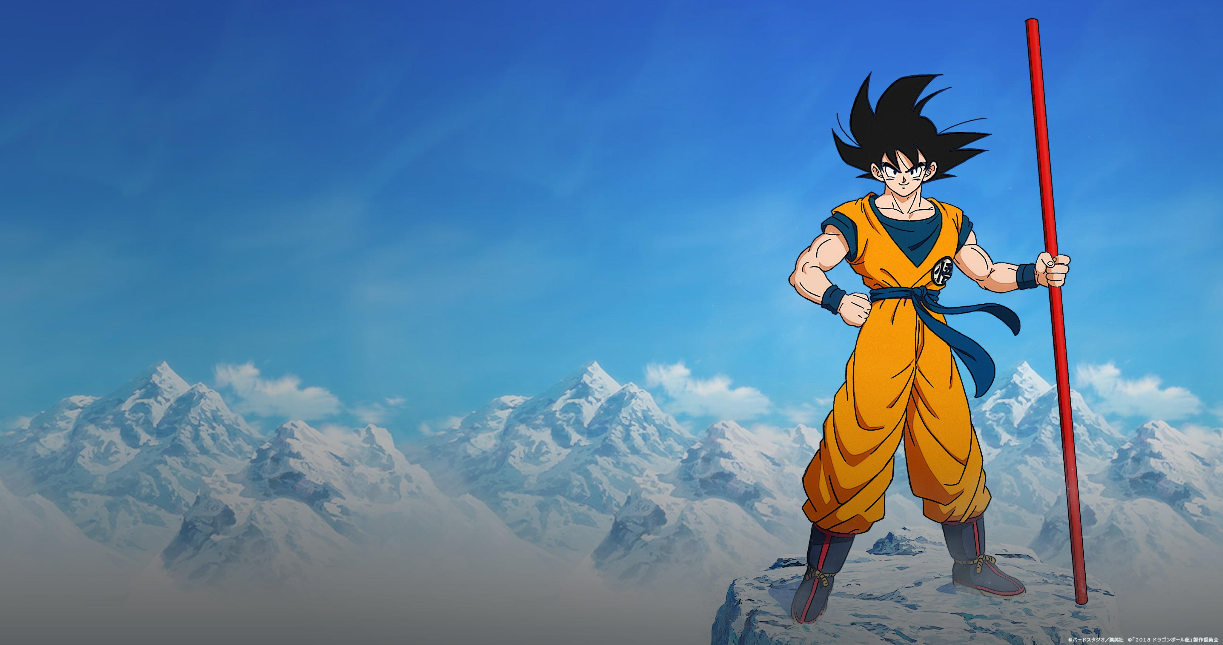 A cartoon character holding up an orange staff - Goku