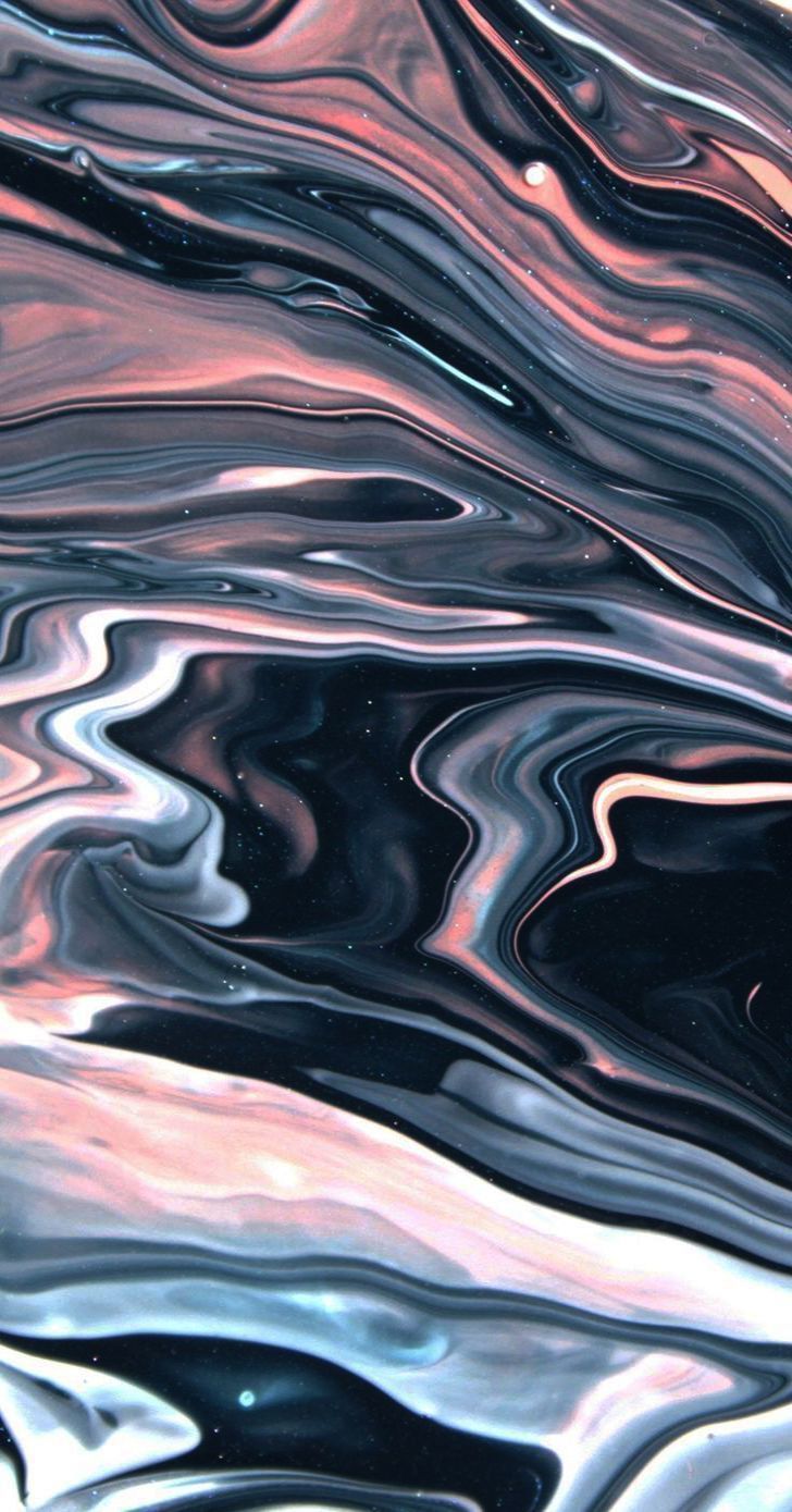A close up of some pink and black marble - Marble