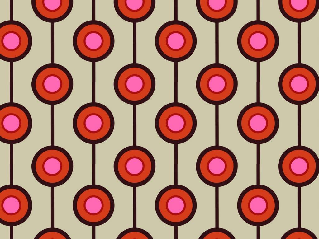 A pattern of red and pink dots on a brown background - 60s