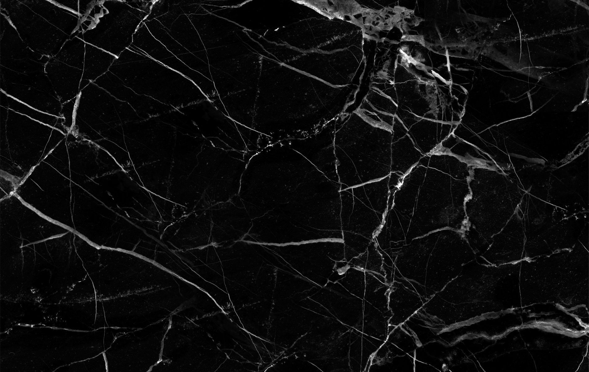 A black and white photo of a marble surface. - Marble