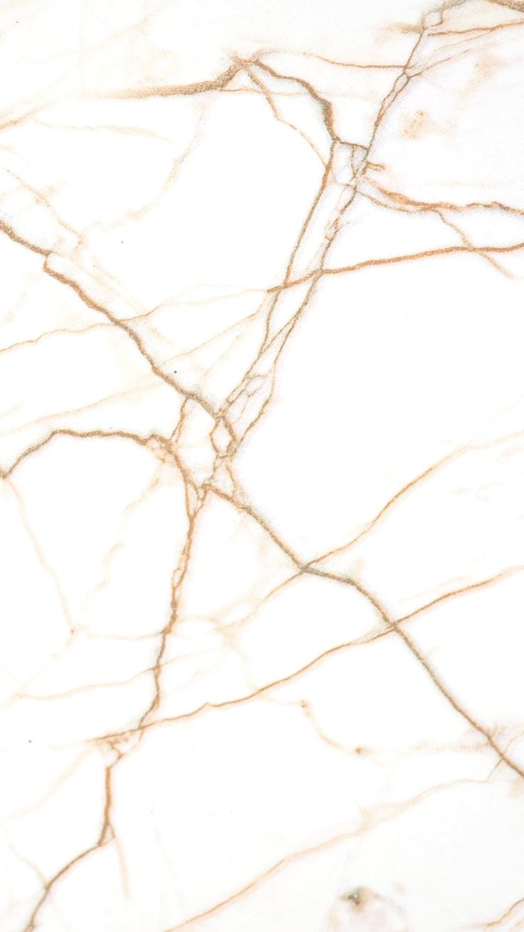 A close up of white marble with gold veins - Marble