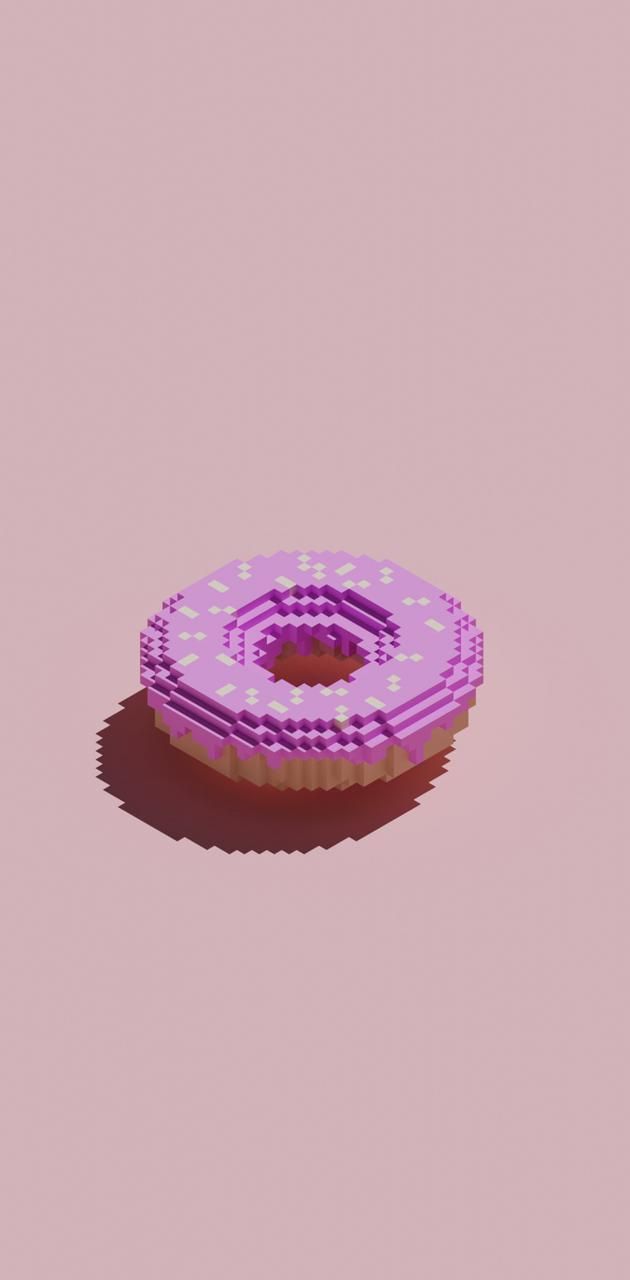 A pink donut sitting on top of some paper - Food