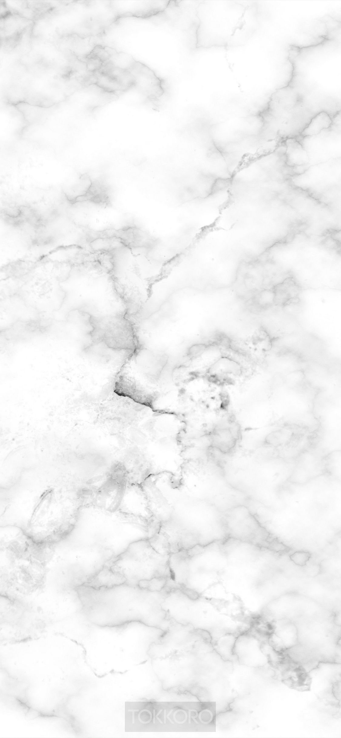 A white marble texture with some black lines - Marble
