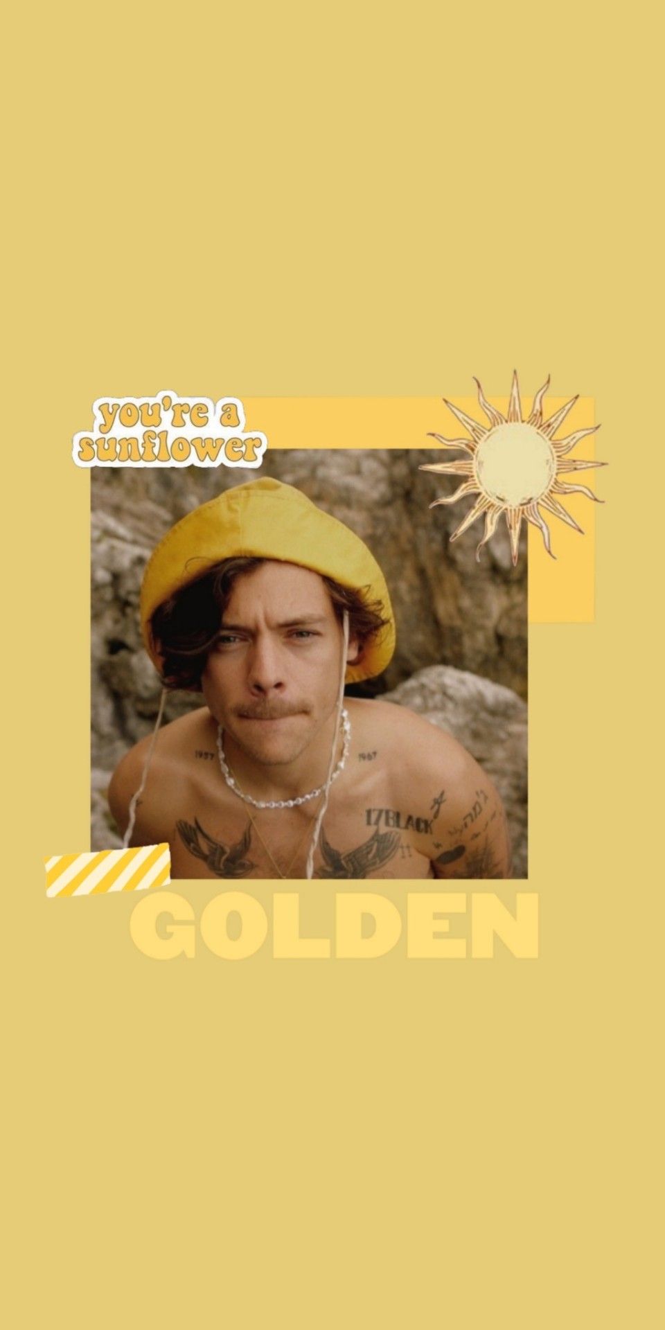 A man in yellow with the word golden - Harry Styles