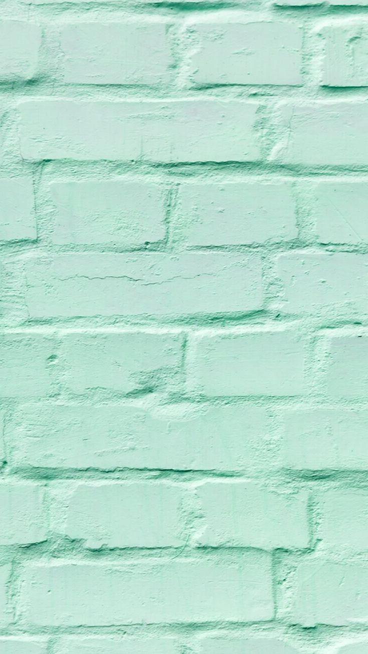 A close up of an old brick wall - Mint green, soft green