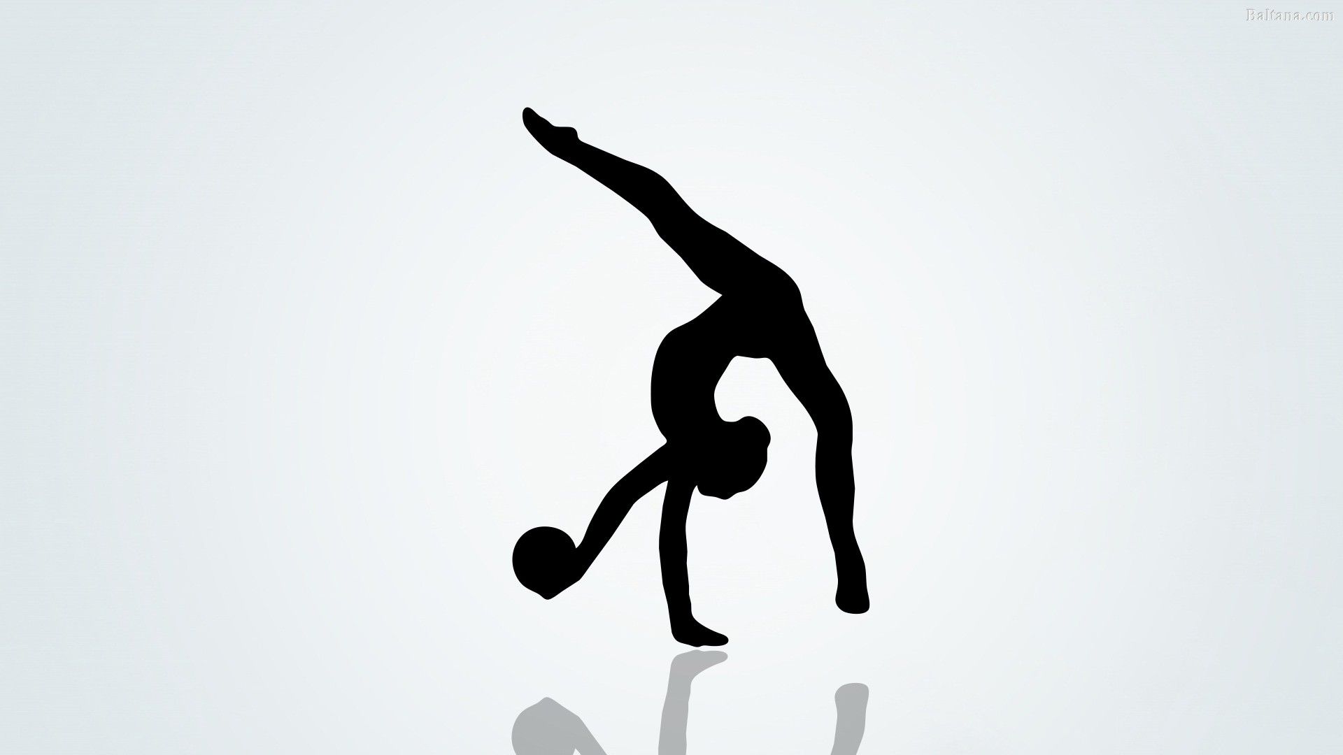 A silhouette of a woman doing a handstand with a ball in her hand - Gymnastics