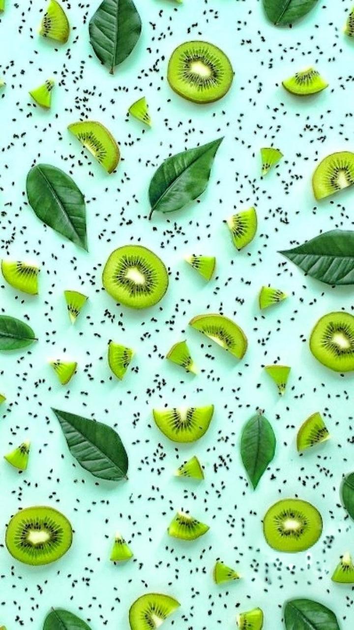 Kiwi fruit and leaves on a blue background - Soft green, lime green, light green, kiwi