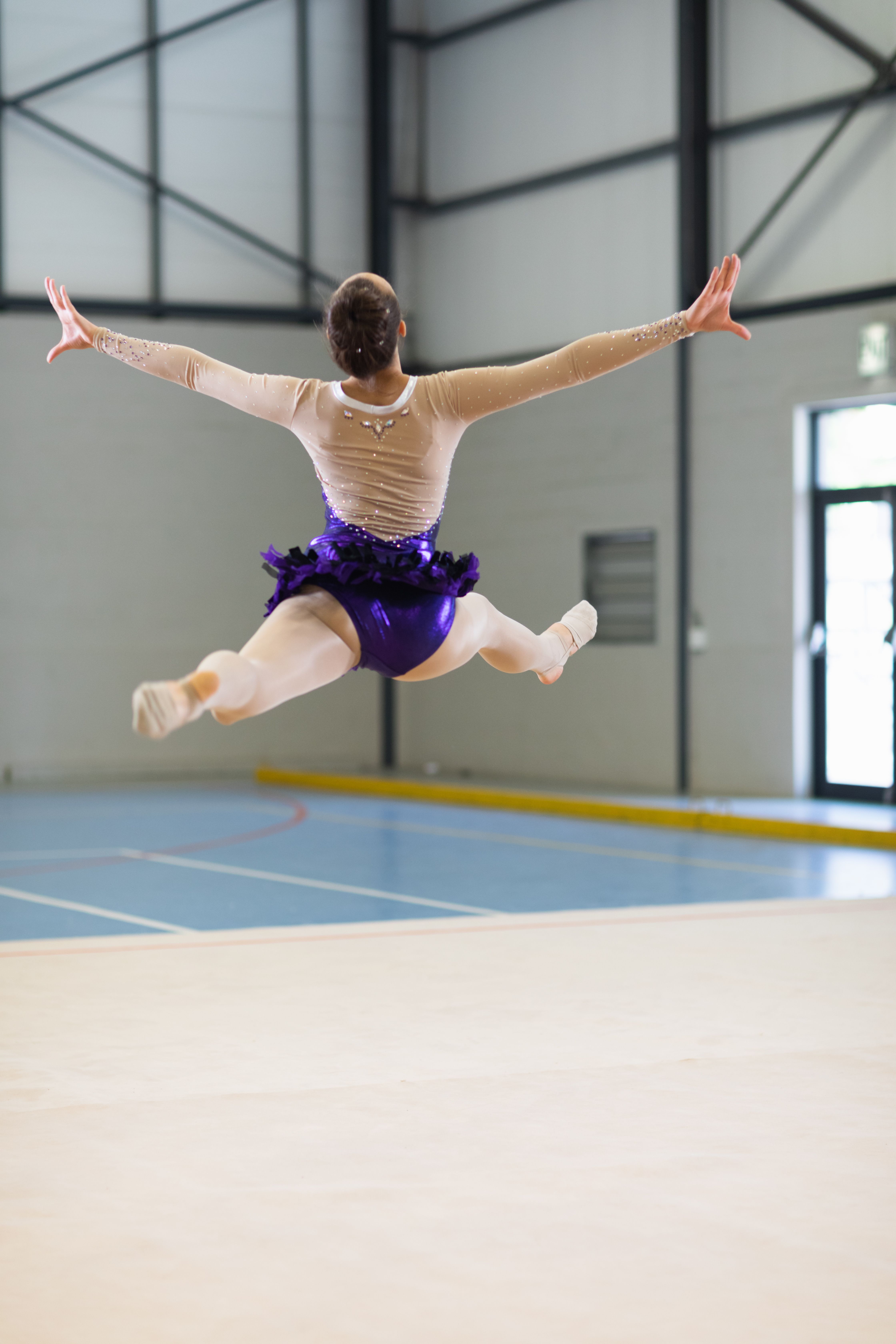 Mixed race female gymnast practicing at the gym Photo from PikWizard