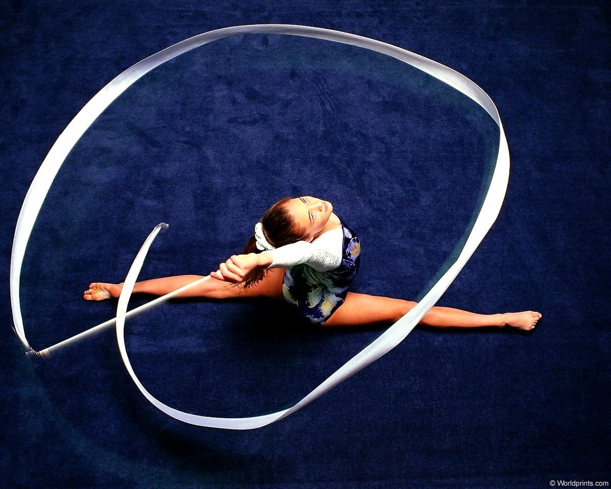 A gymnast doing the splits with a ribbon - Gymnastics