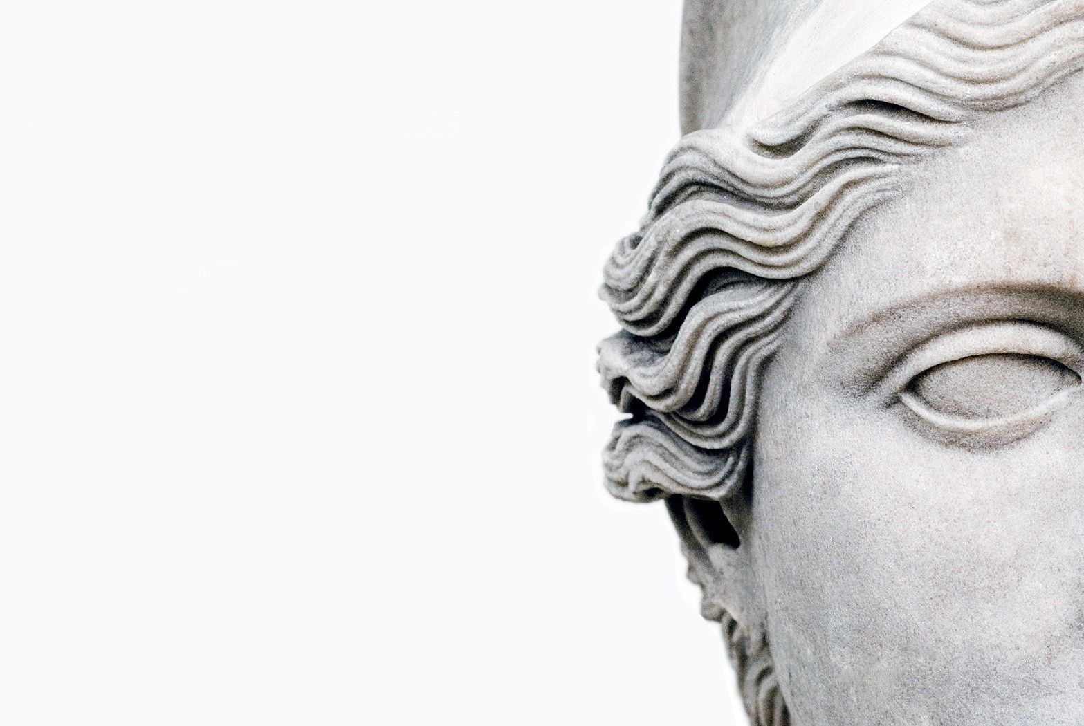 A close up of the face and hairline - Greek statue