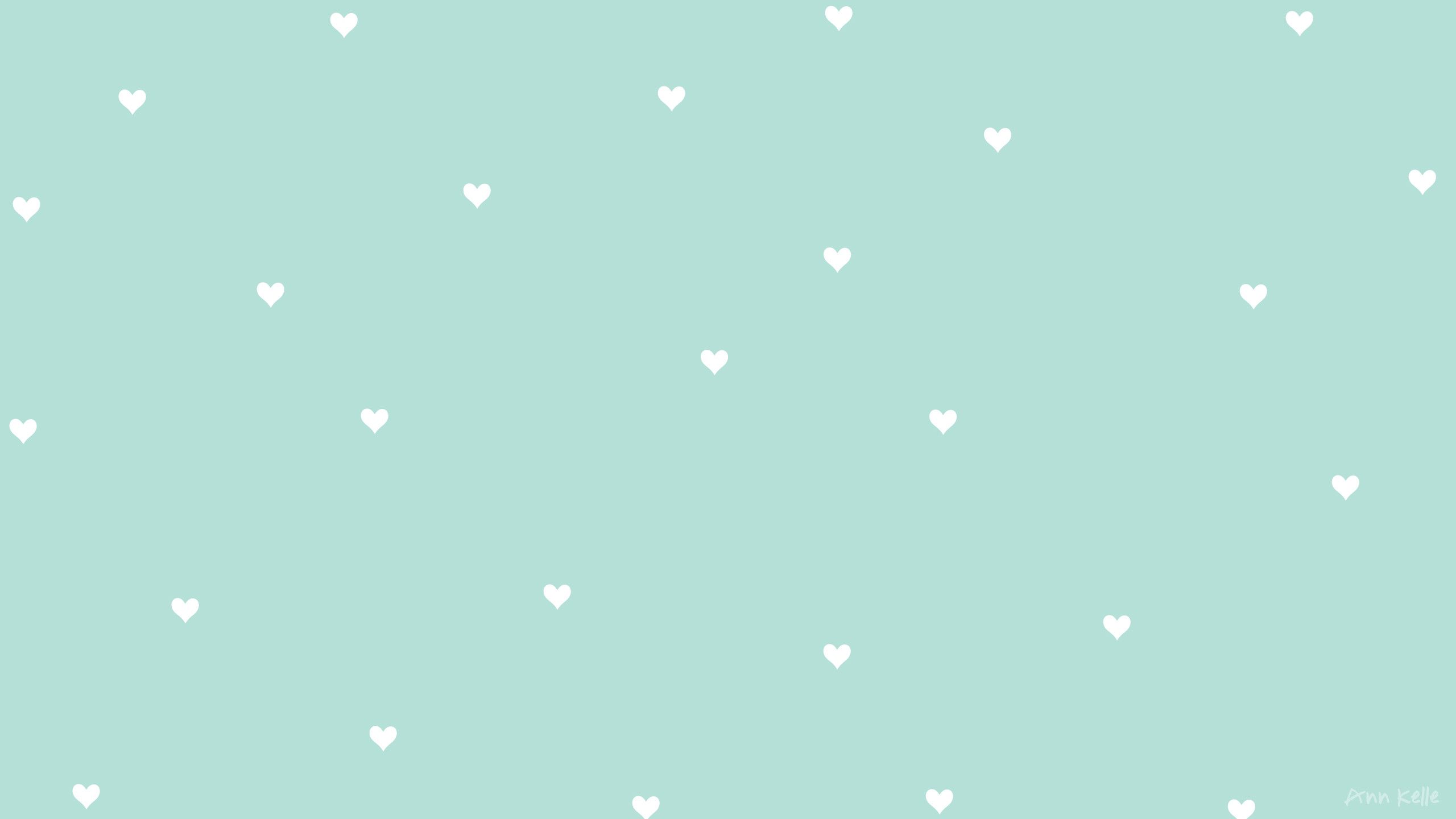 A pattern of white hearts on mint green background - Teal