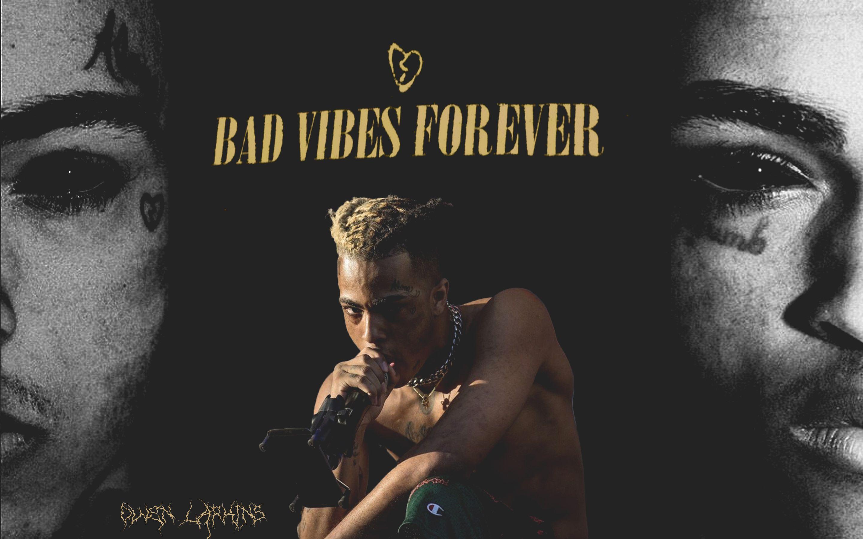 A man with tattoos on his face and the words bad vibes forever - XXXTentacion