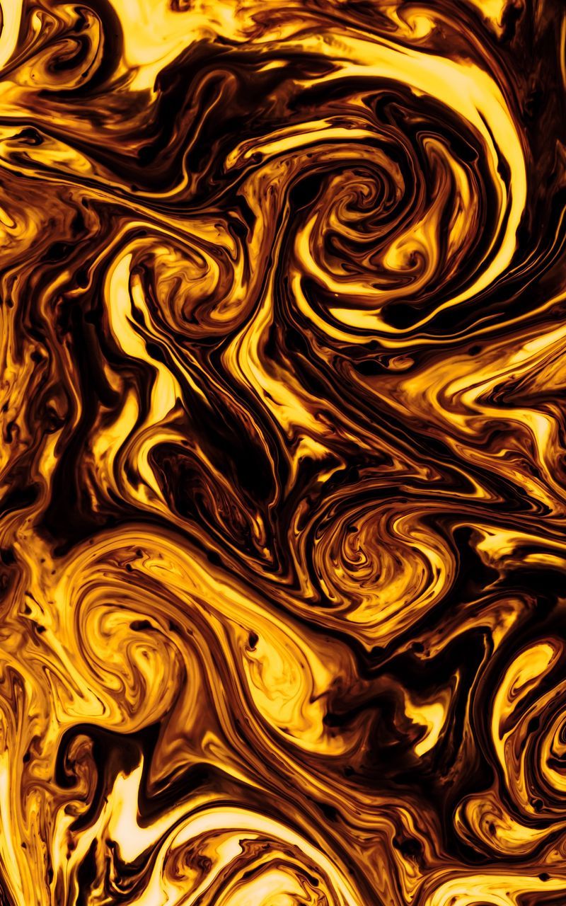 A close up of a swirling pattern of yellow and black - Gold