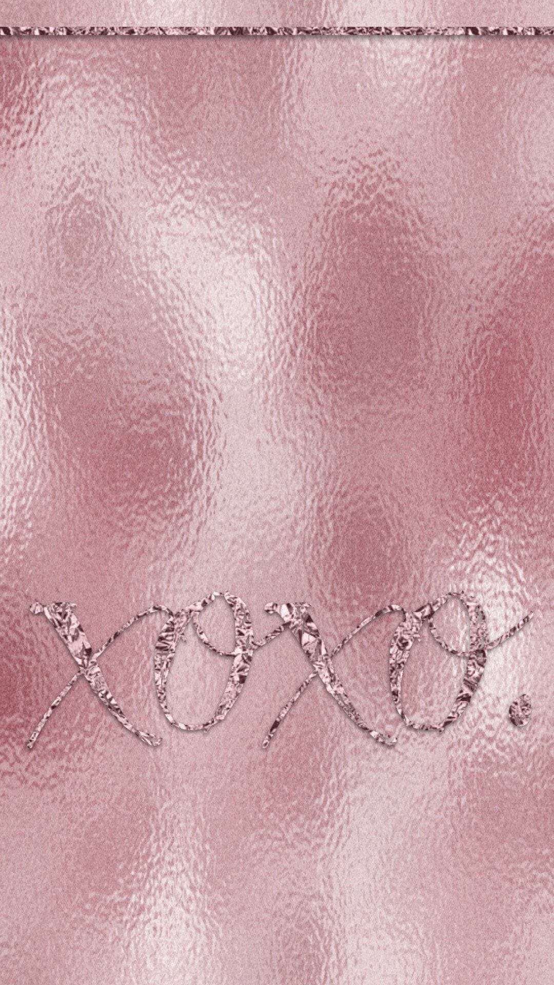 Close up of the xoxo message on the metallic pink clutch - Rose gold