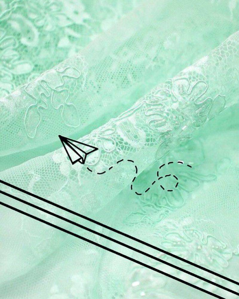 A green fabric with white lace and an airplane - Mint green, pastel green