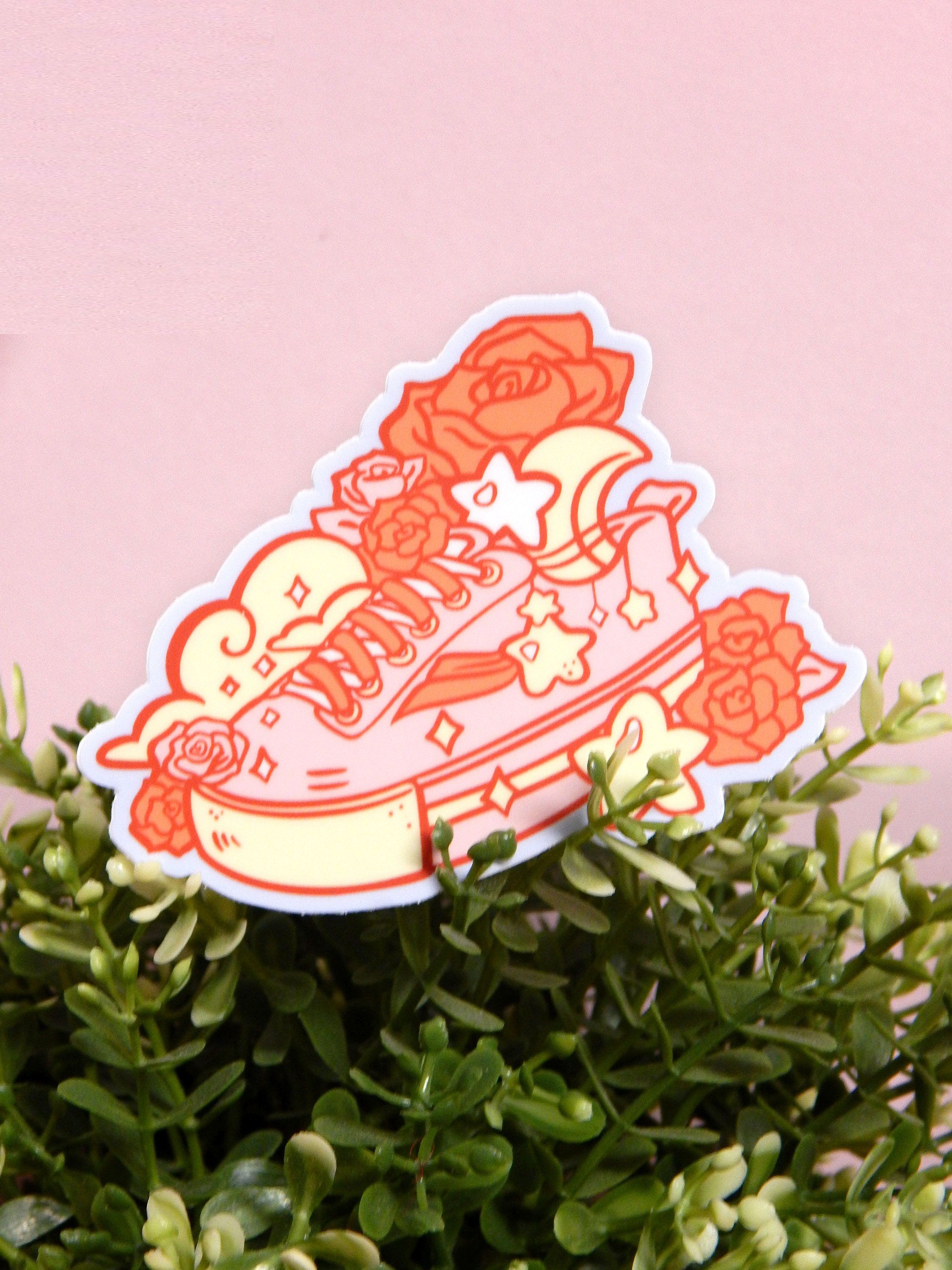 A sticker of sneakers with flowers on it - Shoes