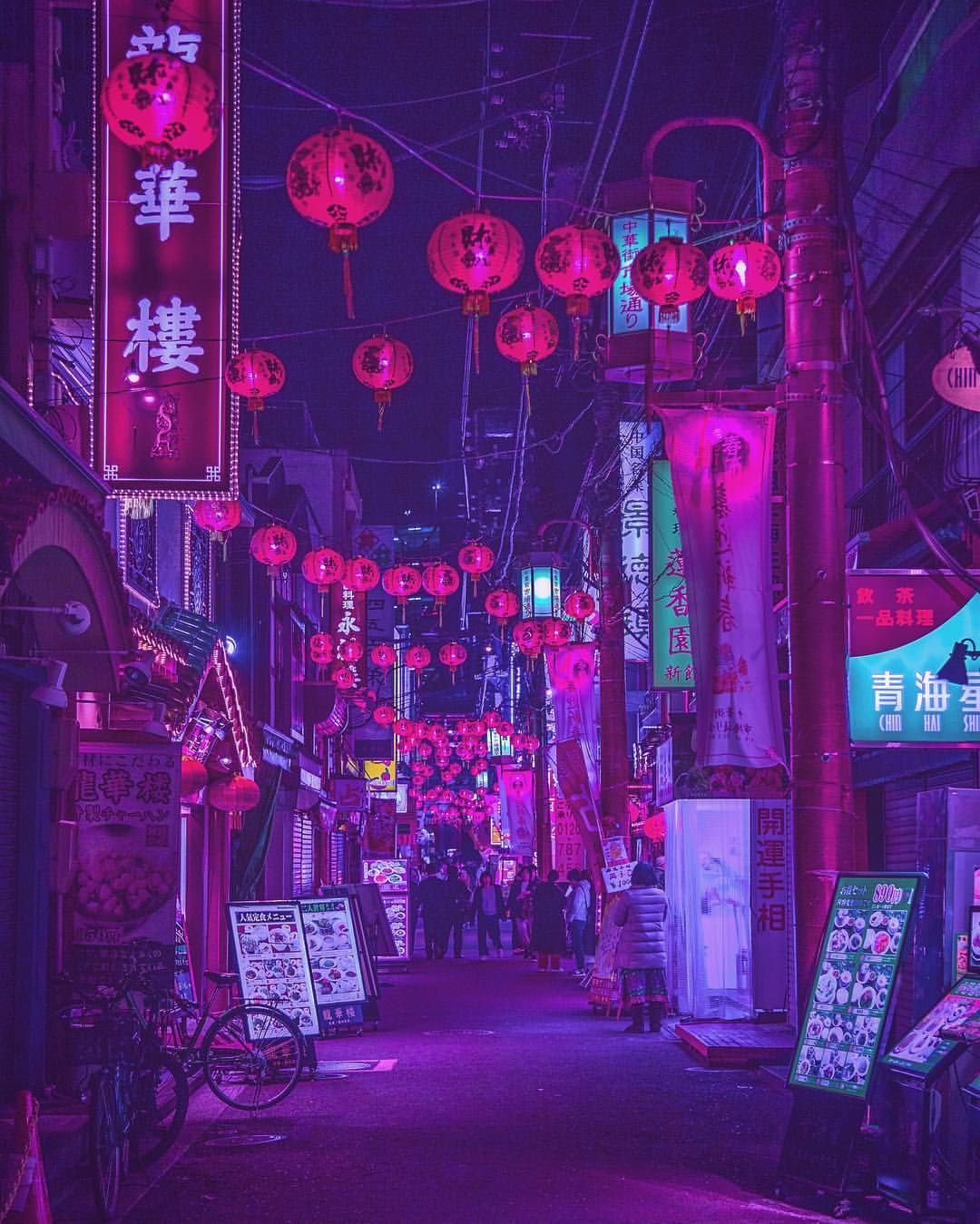 A street in japan at night with lanterns and lights - Tokyo