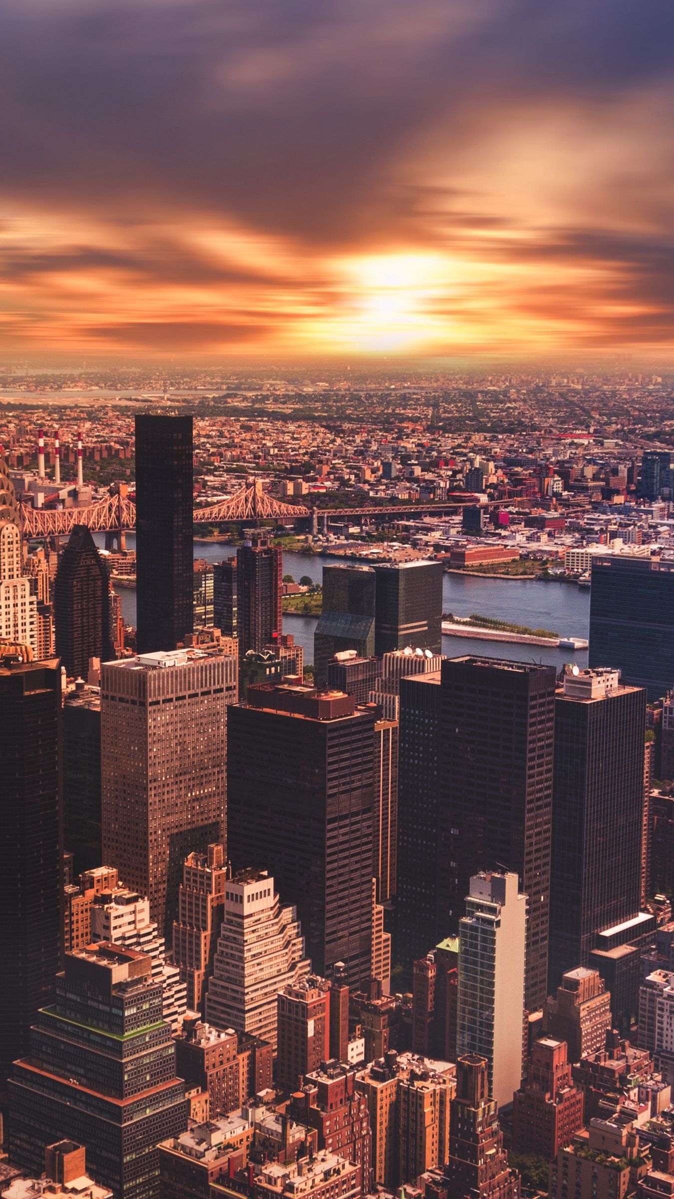 IPhone wallpaper of a cityscape with a sunset in the background - New York