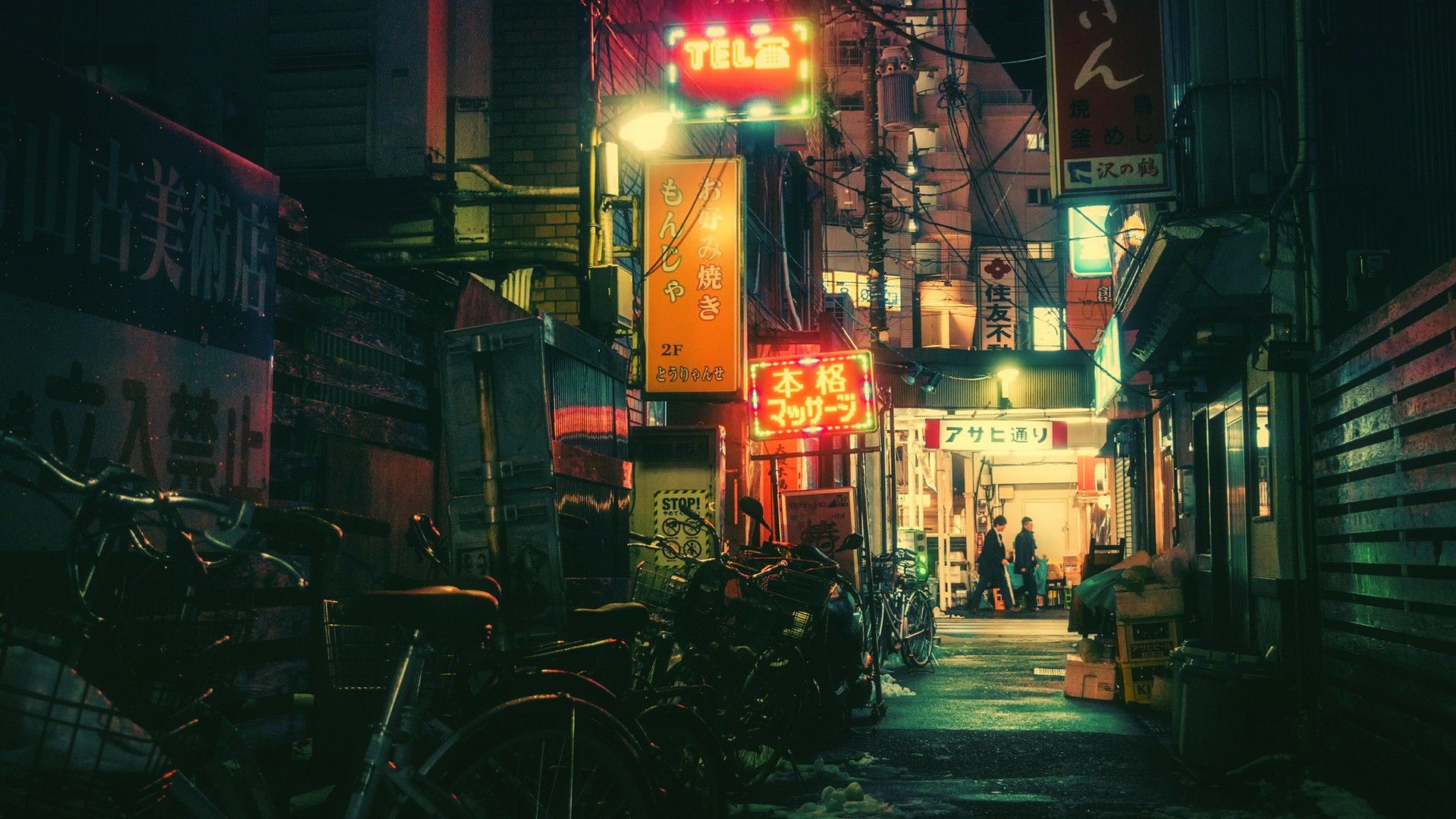 A dark alley with bikes and signs - Tokyo, Japan
