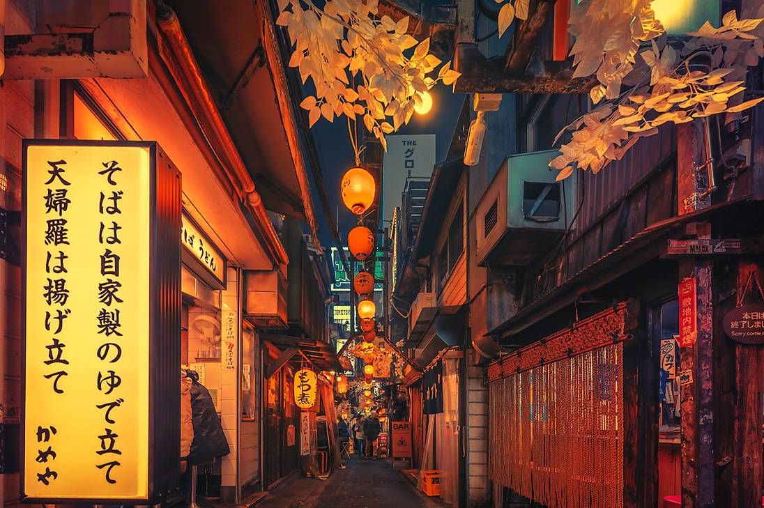 A narrow alleyway with many lanterns and signs - Tokyo