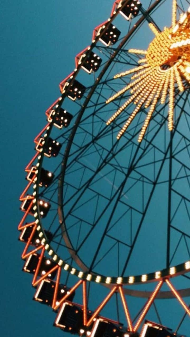 A ferris wheel at night - 60s